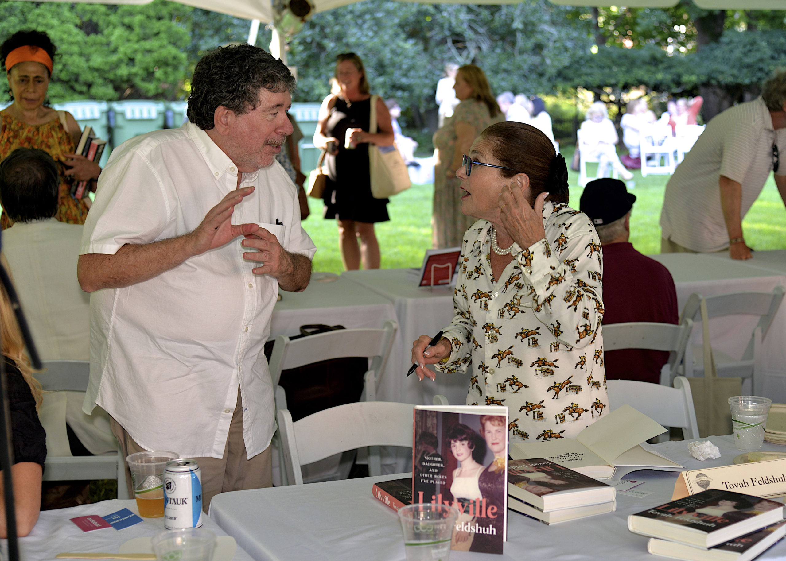 Tom Clavin and Tovah Feldshuh at the East Hampton Library’s 17th Annual Authors Night book signing cocktail party on Saturday evening on the library grounds.             KYRIL BROMLEY
