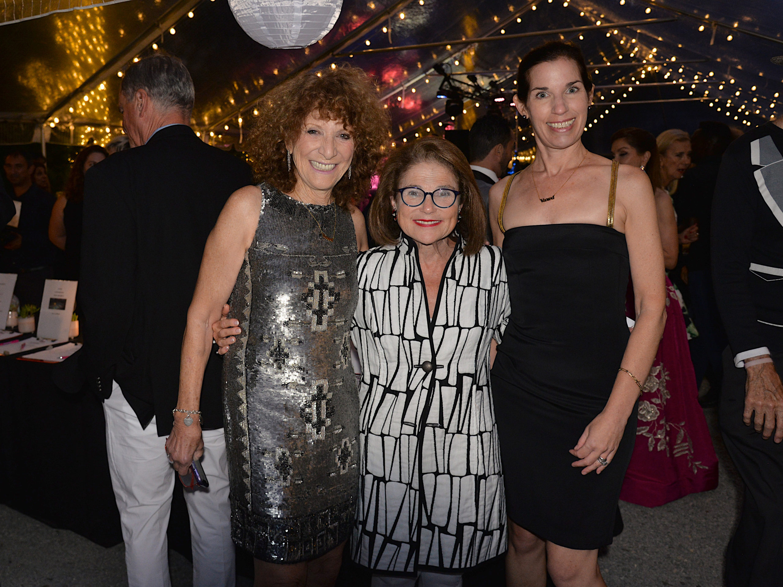 Julie Ratner, honoree Tovah Feldshuh and Anne Gomberg at the Ellen Hermanson Foundation's Back in Black summer benefit on Saturday at Hampton Racquet.   KYRIL BROMLEY