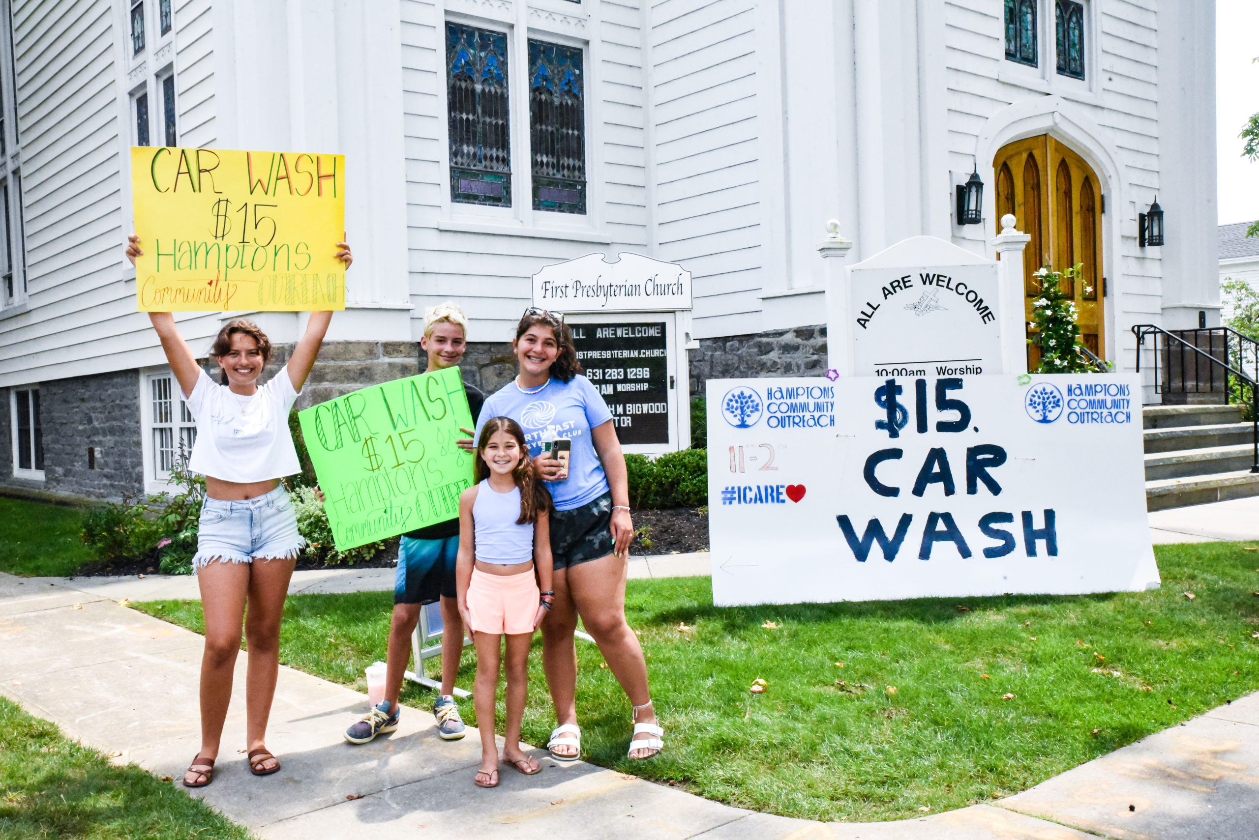Volunteers gathered in Southampton Saturday for a car wash in support of Hamptons Community Outreach.