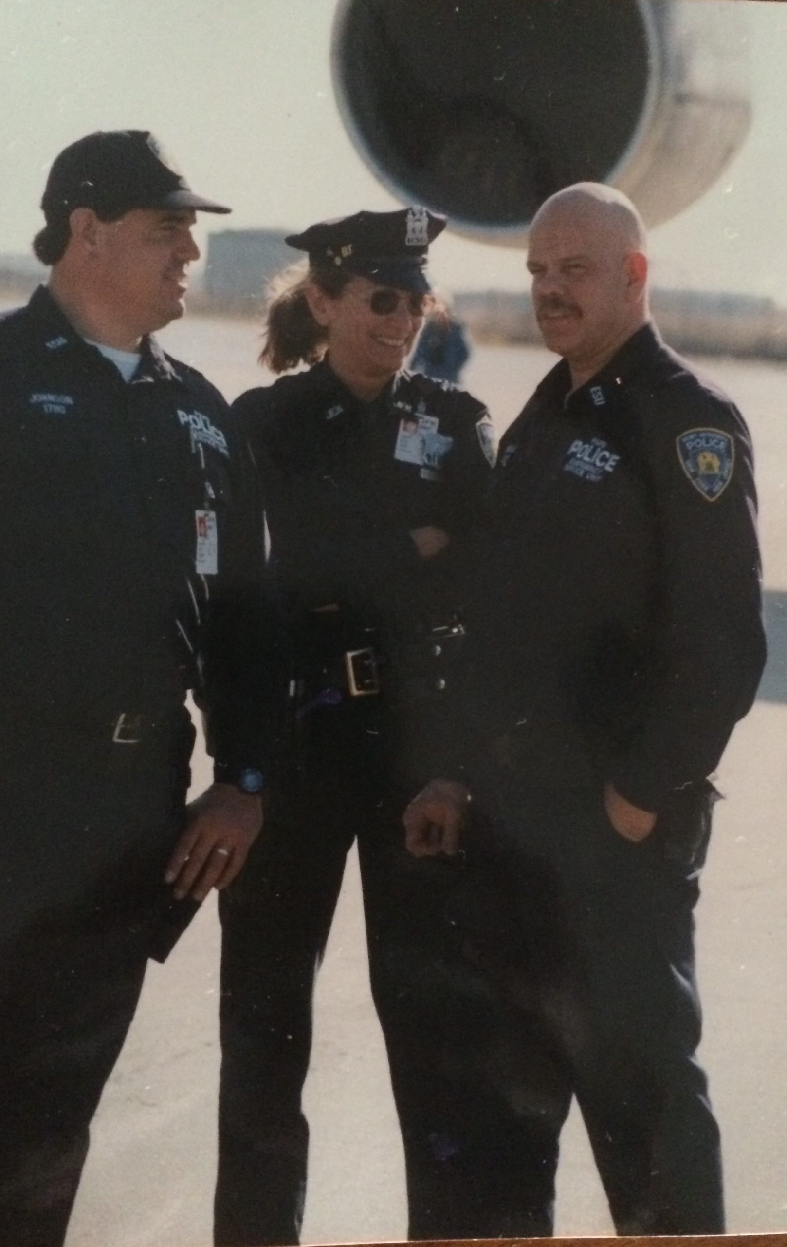 Port Authority Police Officers Pete Johnson, Doris Caridi and George Howard prior to September 11, 2001. Mr. Howard was killed by raining debris during the aftermath of the terrorist attack, after rushing to the scene on his day off to help.