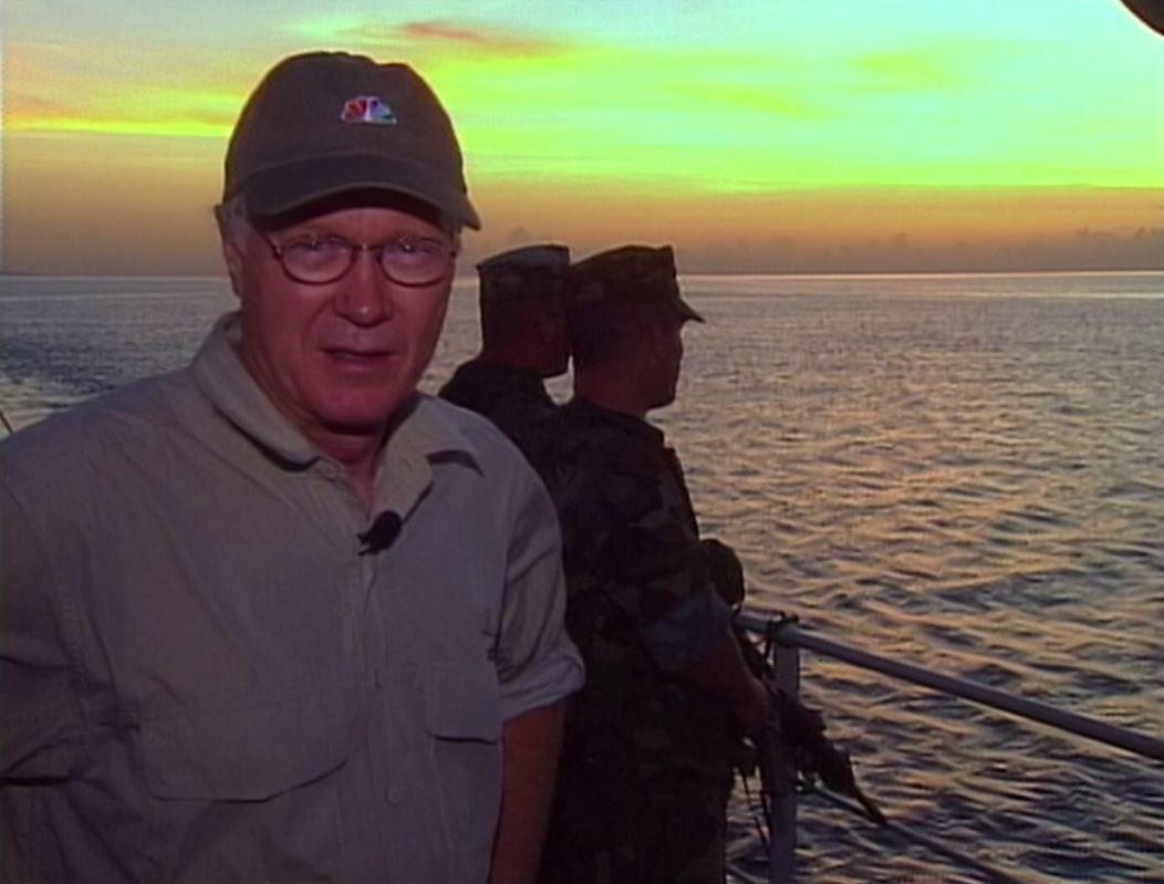 On the deck of a resupply boat with a squad of heavily armed U.S. Marines heading from Zamboanga City to Basilan Island with ammunition, food and water for special forces operators there as he was reporting on the U.S. military effort there to help the Philippine army hunt down an Al Qaeda affiliated terror group post 9/11.