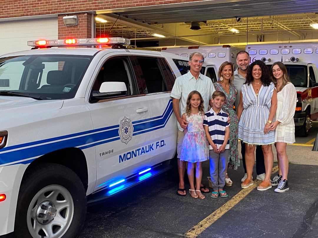 With an incredible display of generosity and community spirit, the Hildreth and Kansler Families of Montauk recently donated a critically valuable vehicle to the Montauk Fire Department. Here they are standing beside the new fully equipped Chevy Tahoe that they donated. The vehicle, designated 