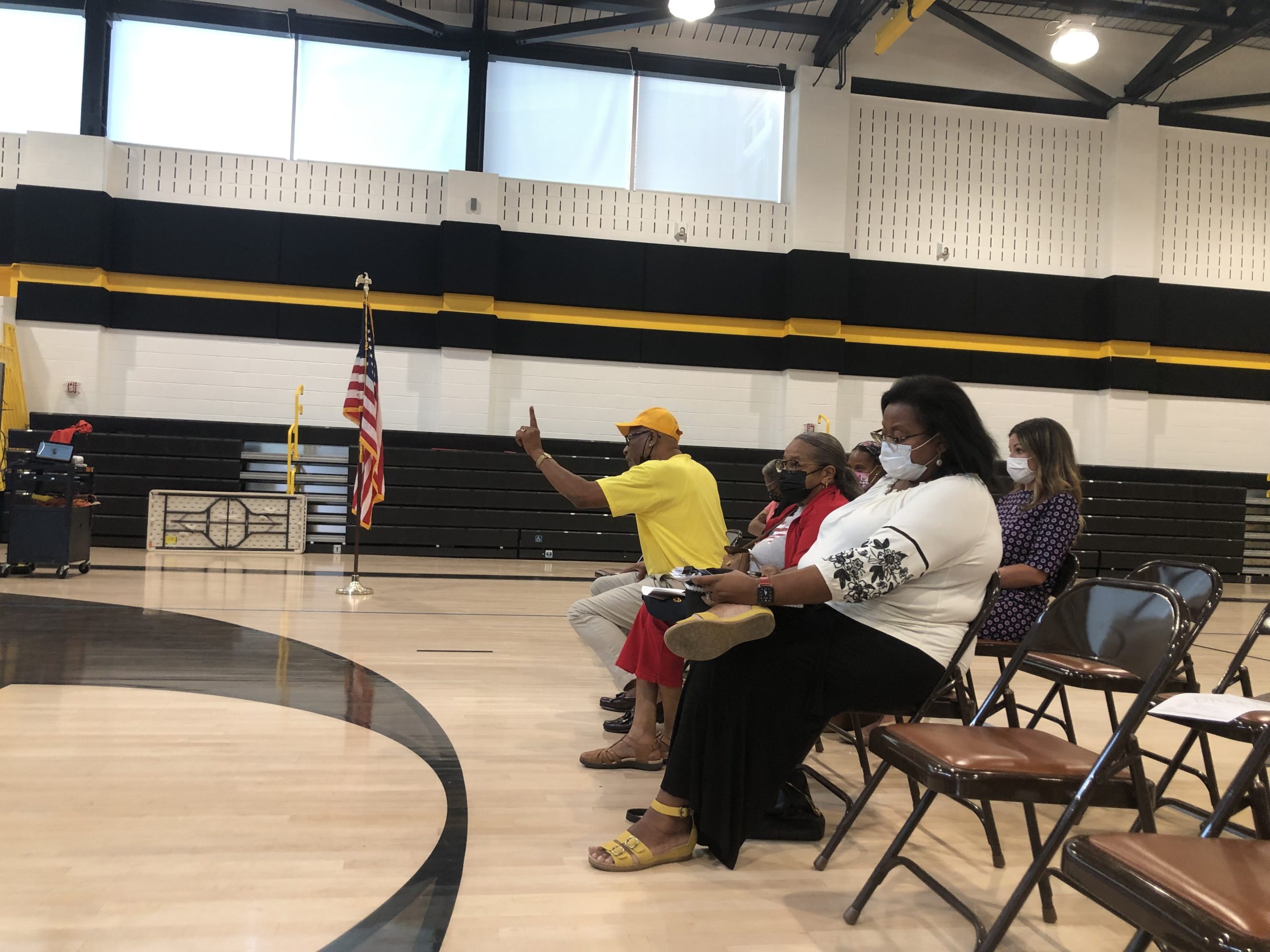 Denise Merchant (in white) and Larry Street (in yellow) from the local chapter of the NAACP. CAILN RILEY