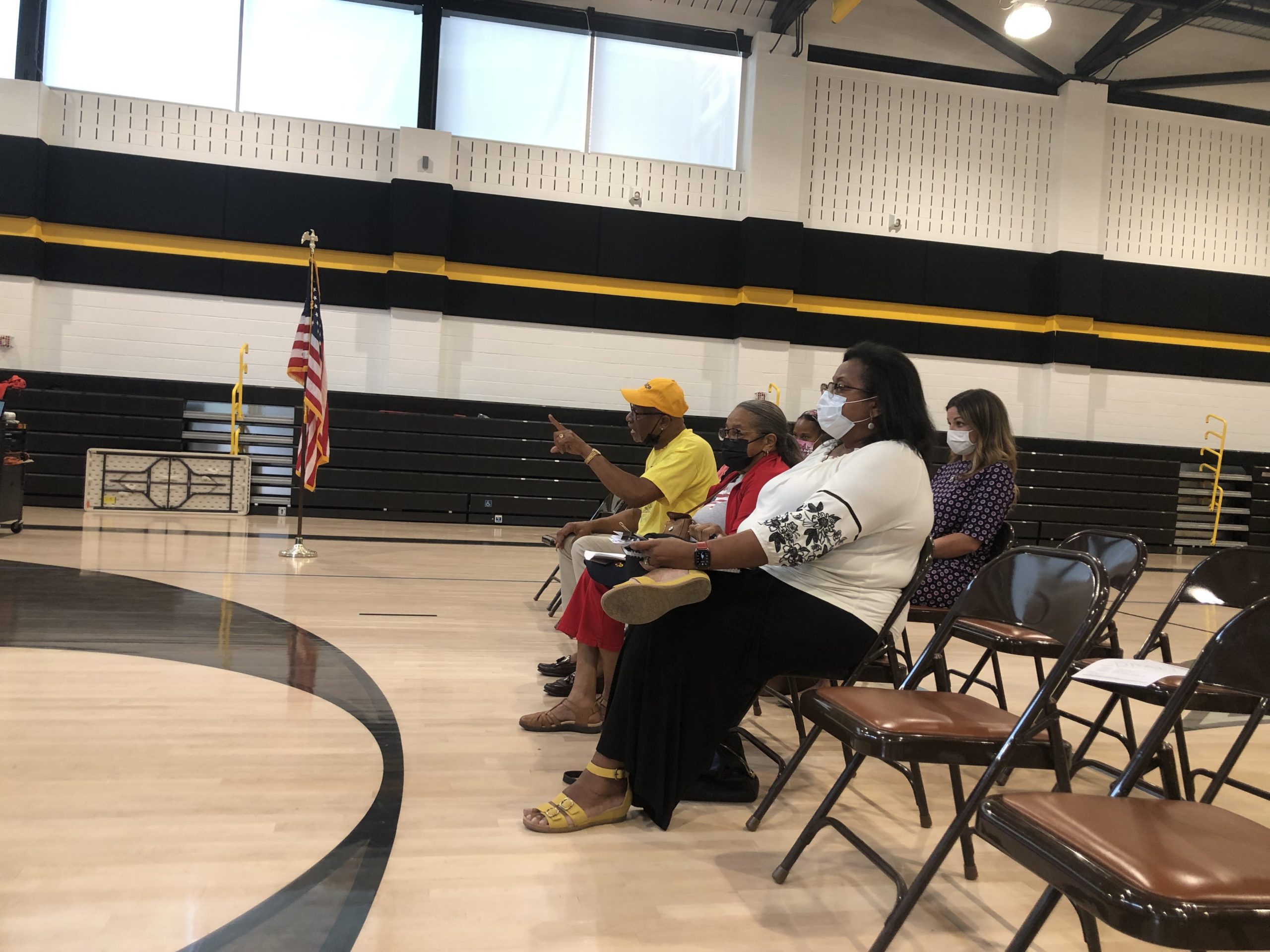 Denise Merchant (in white) and Larry Street (in yellow) from the local chapter of the NAACP. CAILN RILEY