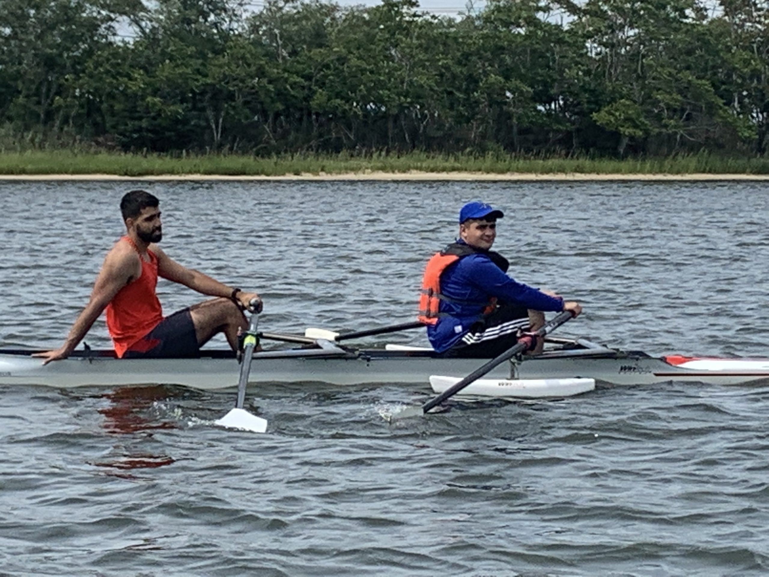 James Reicer, left, looks on as Dimitri Donus practices his stroke. STEPHEN J. KOTZ