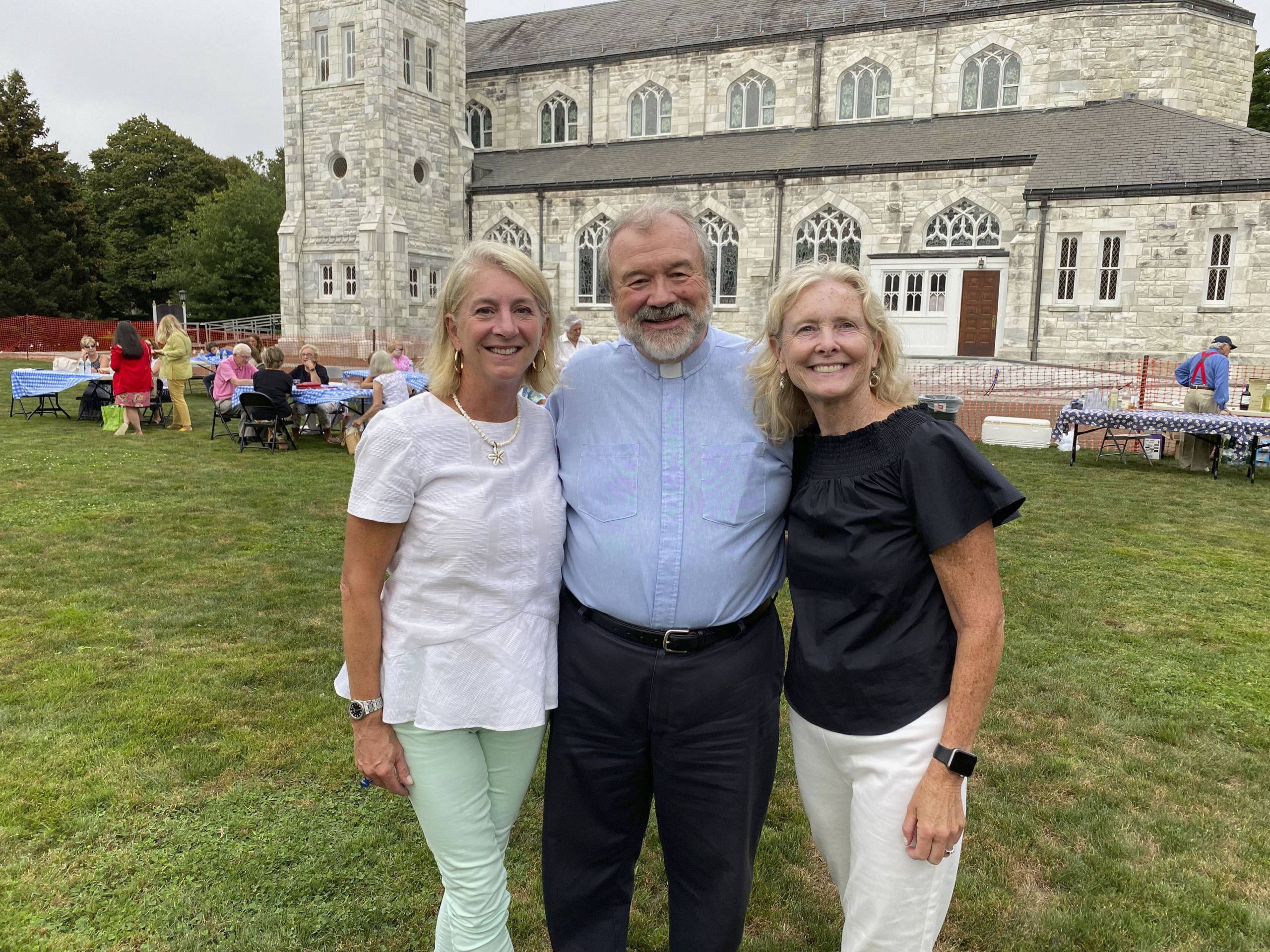 Amy Goodfriend, Father Mike and Katie Shah at Sacred Heart BBQ.   GREG D'ELIA