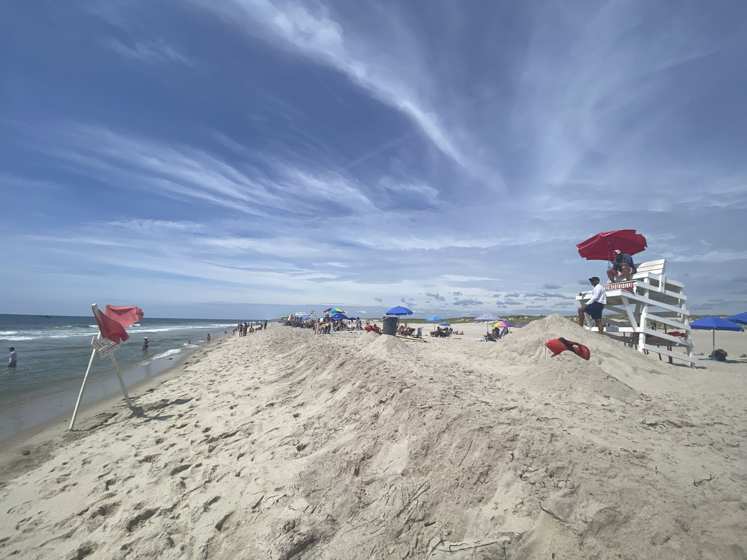 All beaches west of the Shinnecock Canal are closed to swimming due to shark sightings.   DANA SHAW