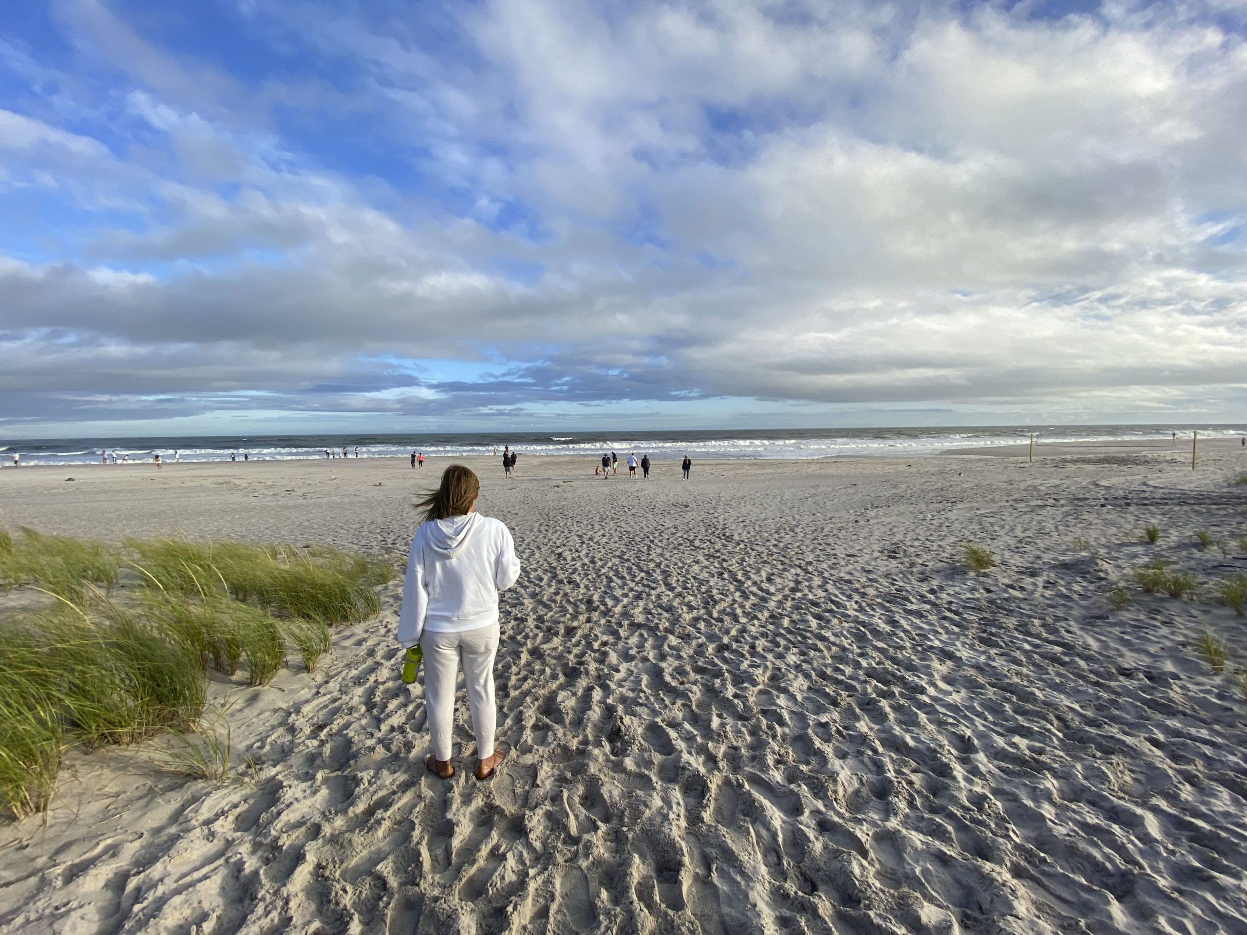 By 6 p.m. on Sunday, Tropical Storm Henri was a memory. The sun was ous out and people flocked to Ponquogue Beach in Hampton Bays to watch the still roiling surf.    DANA SHAW