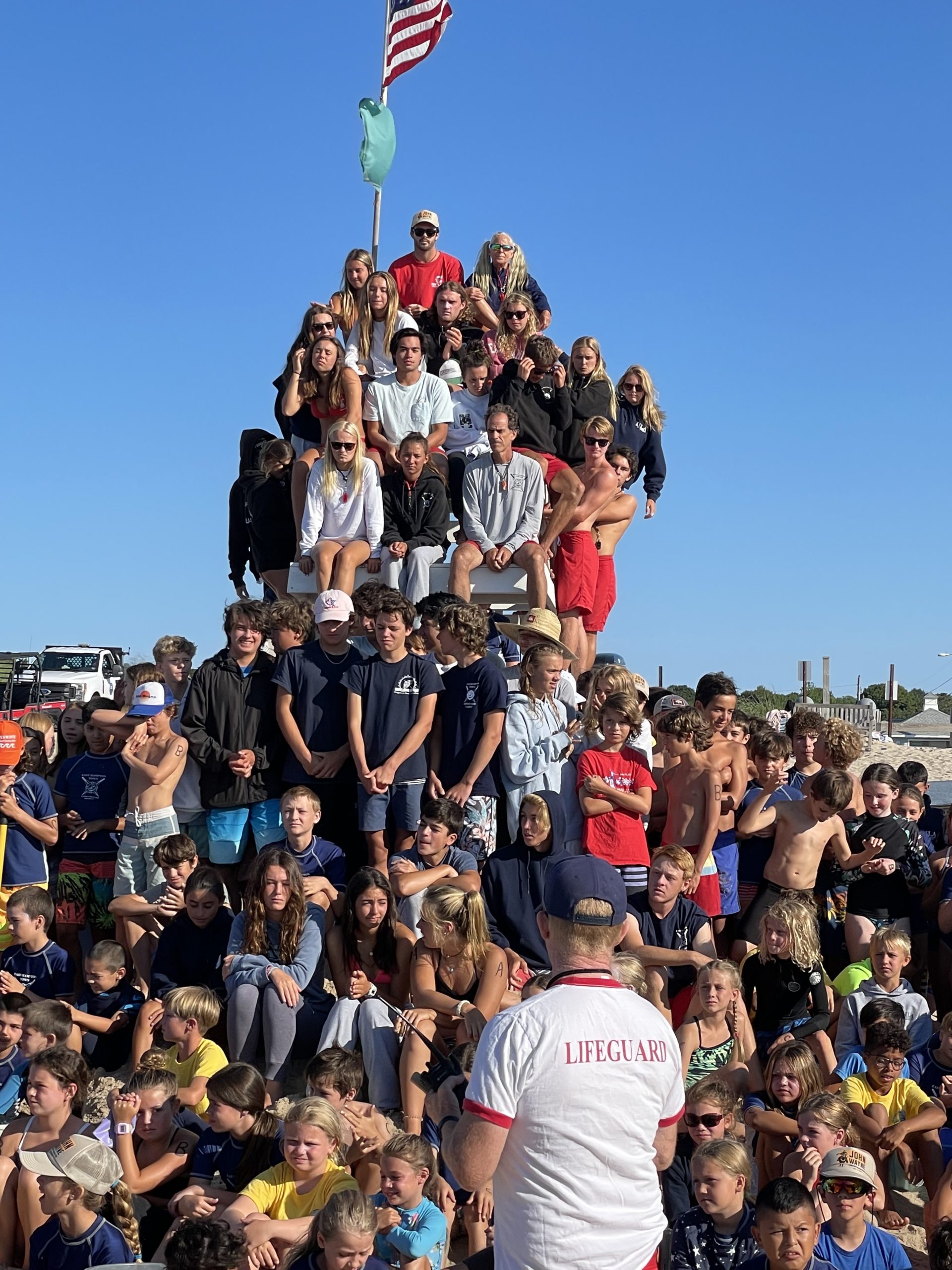 Head Lifeguard John Ryan Jr. speaks to junior lifeguards before the start of the tournament on Saturday.