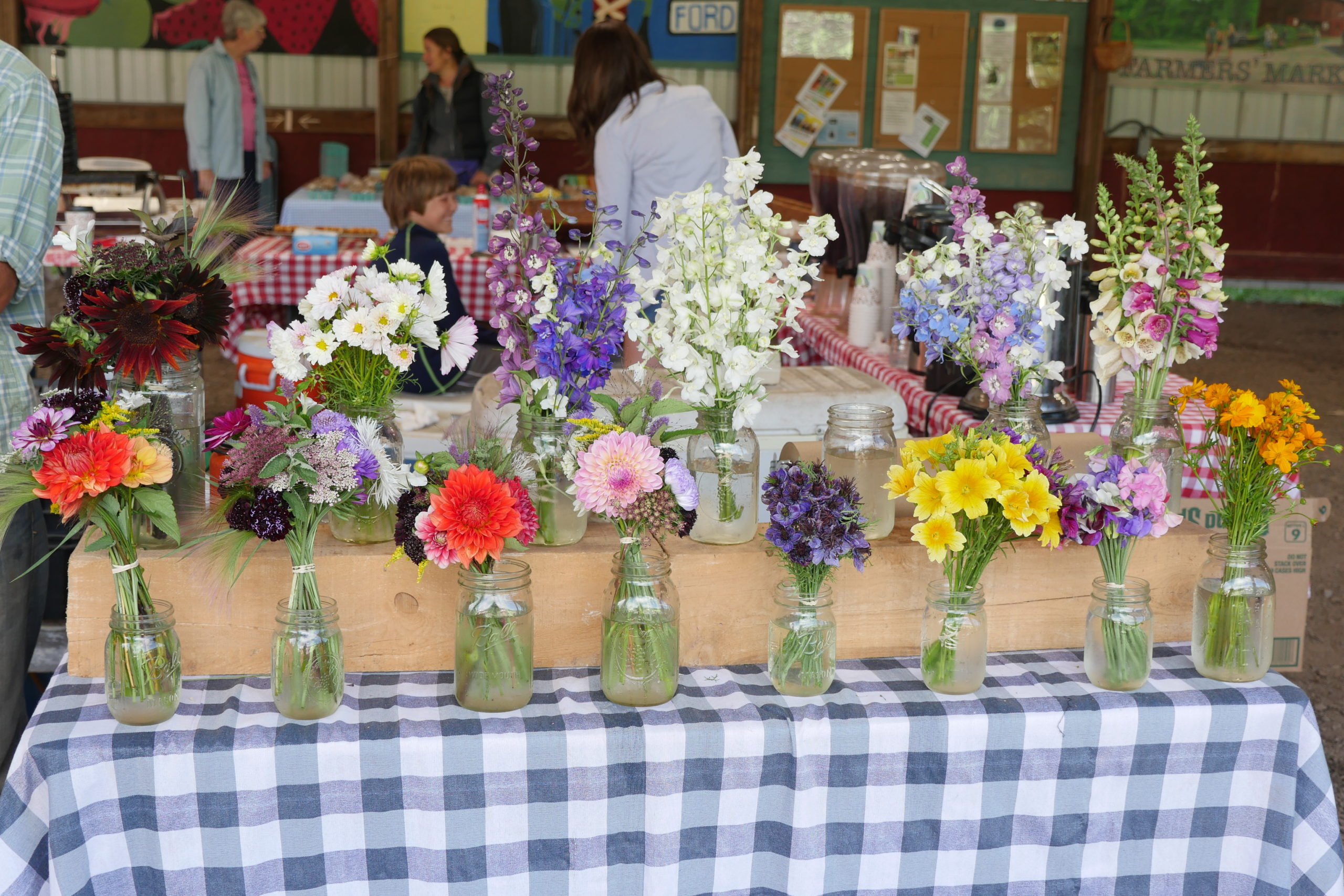 Cut flowers being sold at a farmers market. Why pay for these when you can grow everything in the photo in your garden or cutting garden? These are all annuals. ANDREW MESSINGER