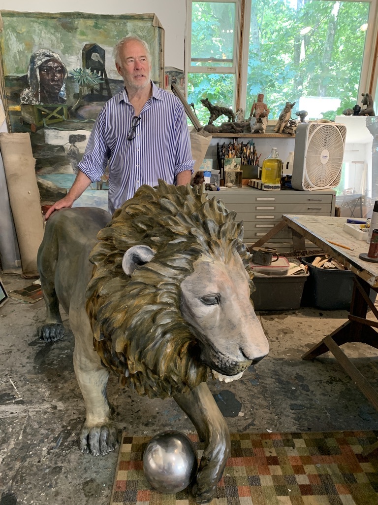 Artist Paton Miller and his artistic lion in his Southampton studio.