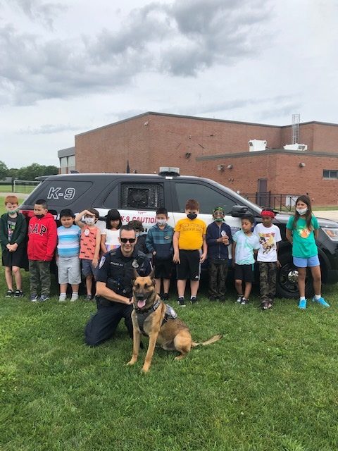 Students participating in the Southampton Union Free School District’s Extended School Year Program recently enjoyed a two-part visit with local police officers. Among the topics discussed were the differences between emergencies and non-emergencies, how to provide information to 911 dispatchers, the job of a police officer, the inner workings of police vehicles and sirens, and K-9 training and handling.