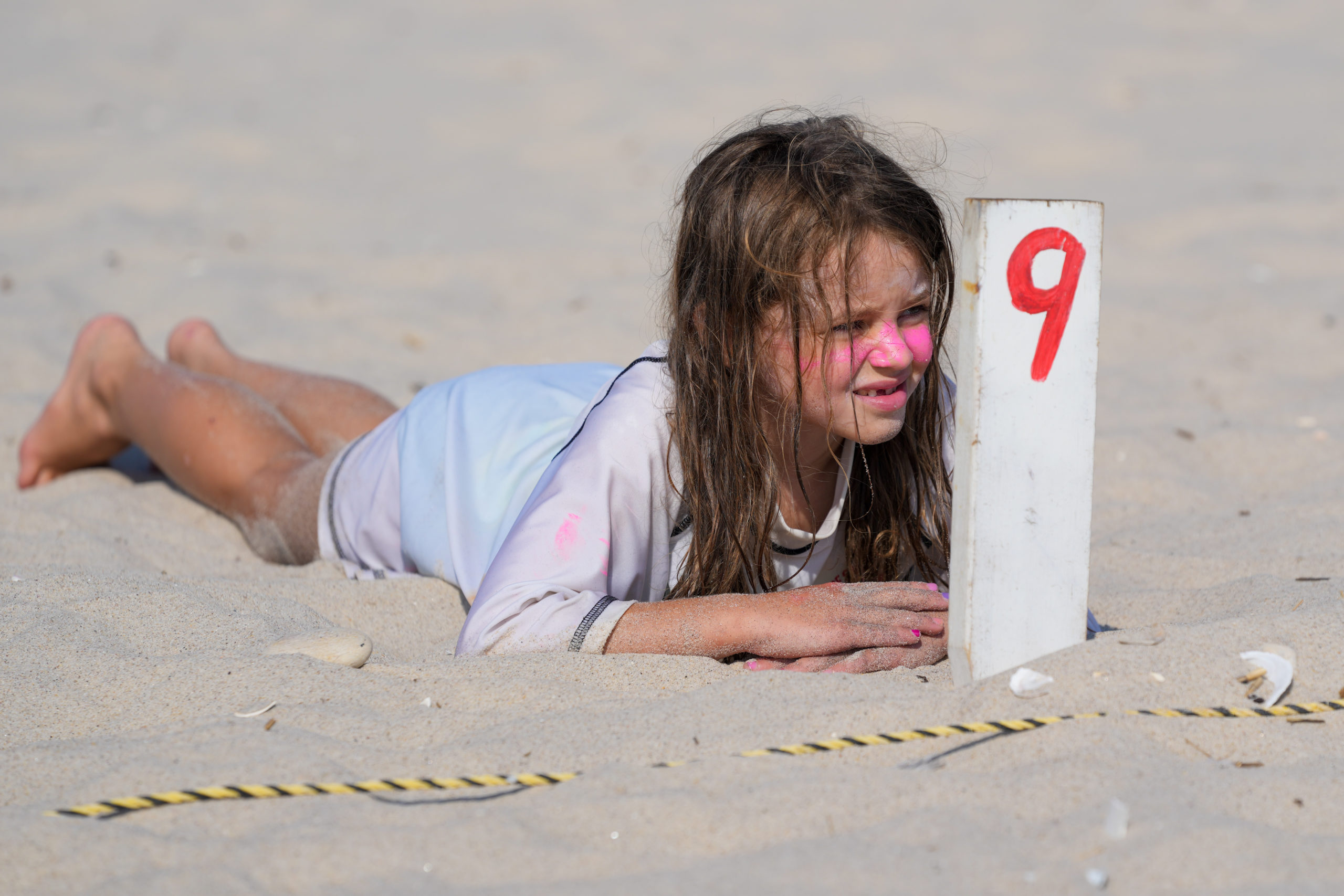 Riley Nichols awaits the whistle in beach flags.