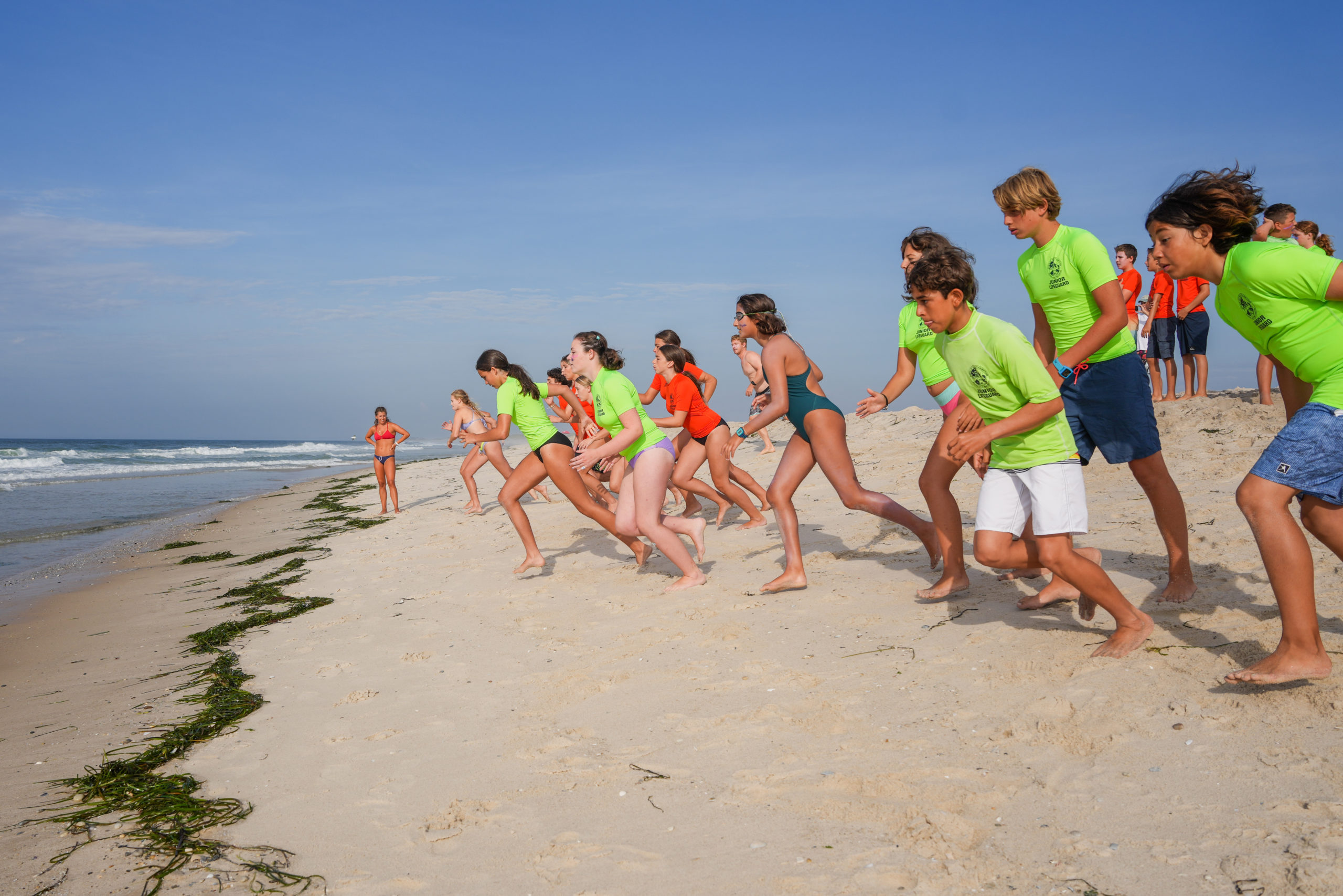 Junior lifeguards get set to go into the surf at Ponquogue Beach.