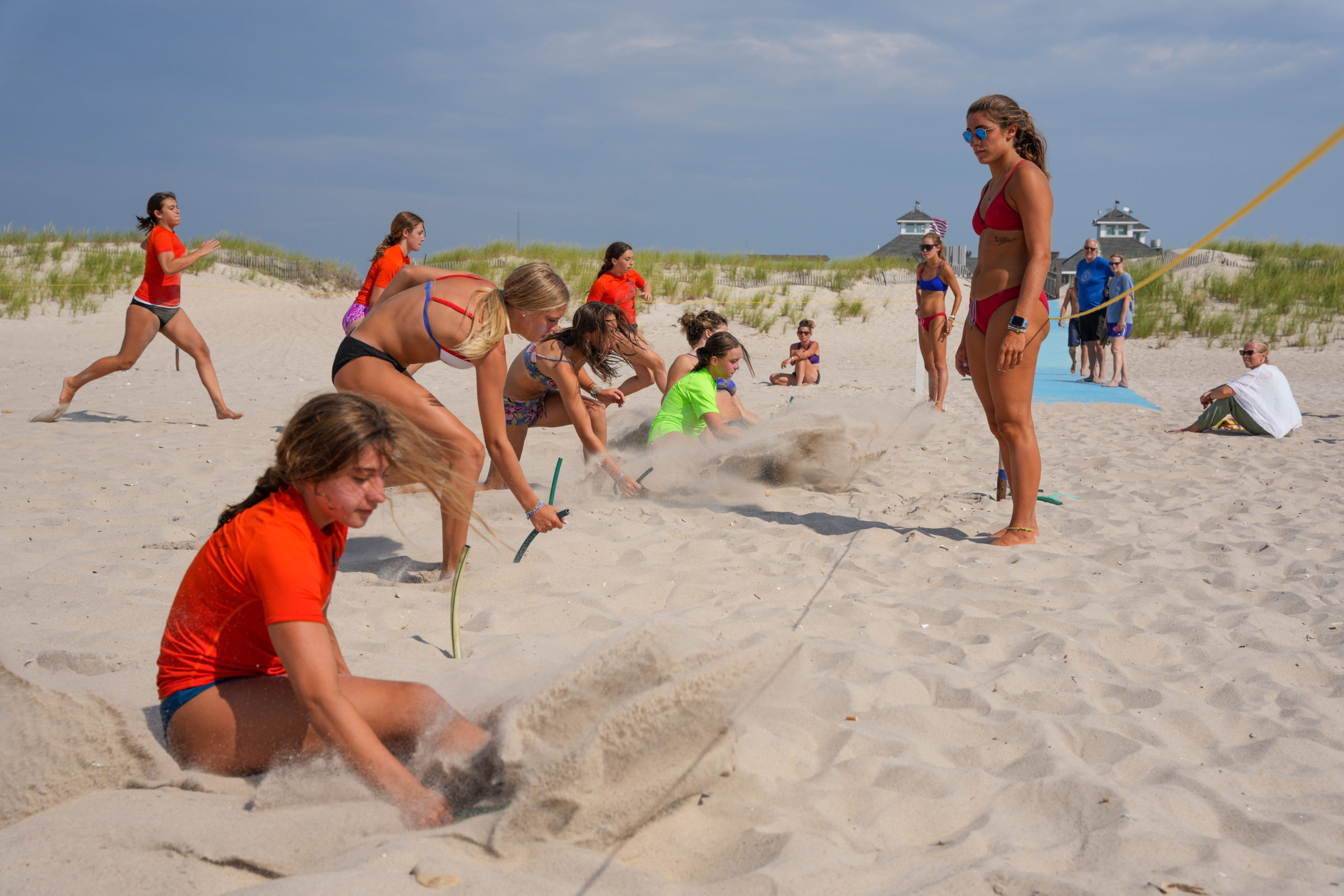 Junior guards battle it out for a beach flag.