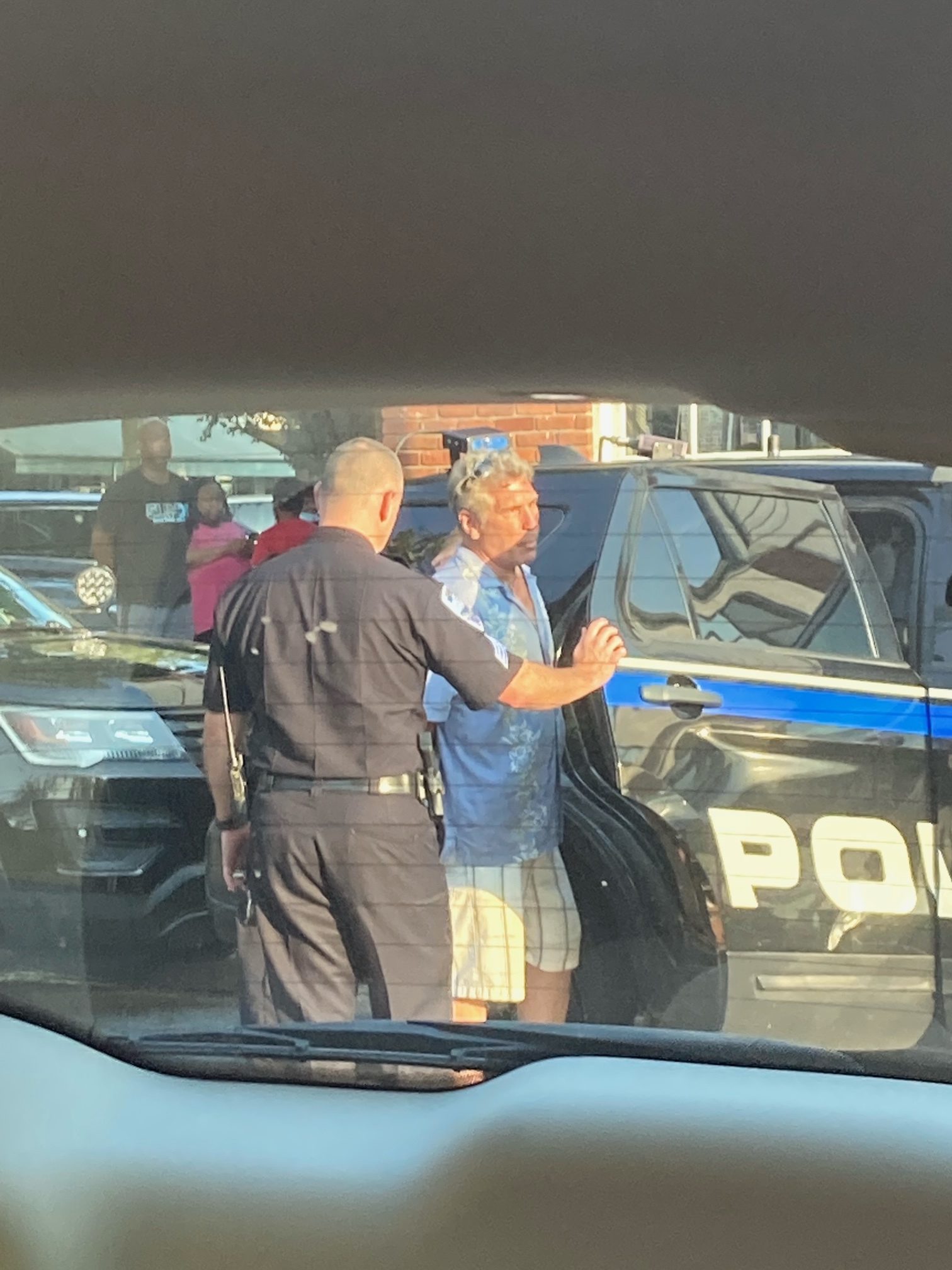 Bill Tabert, owner of the Sag Harbor Launderette, is taken into custody on Friday.