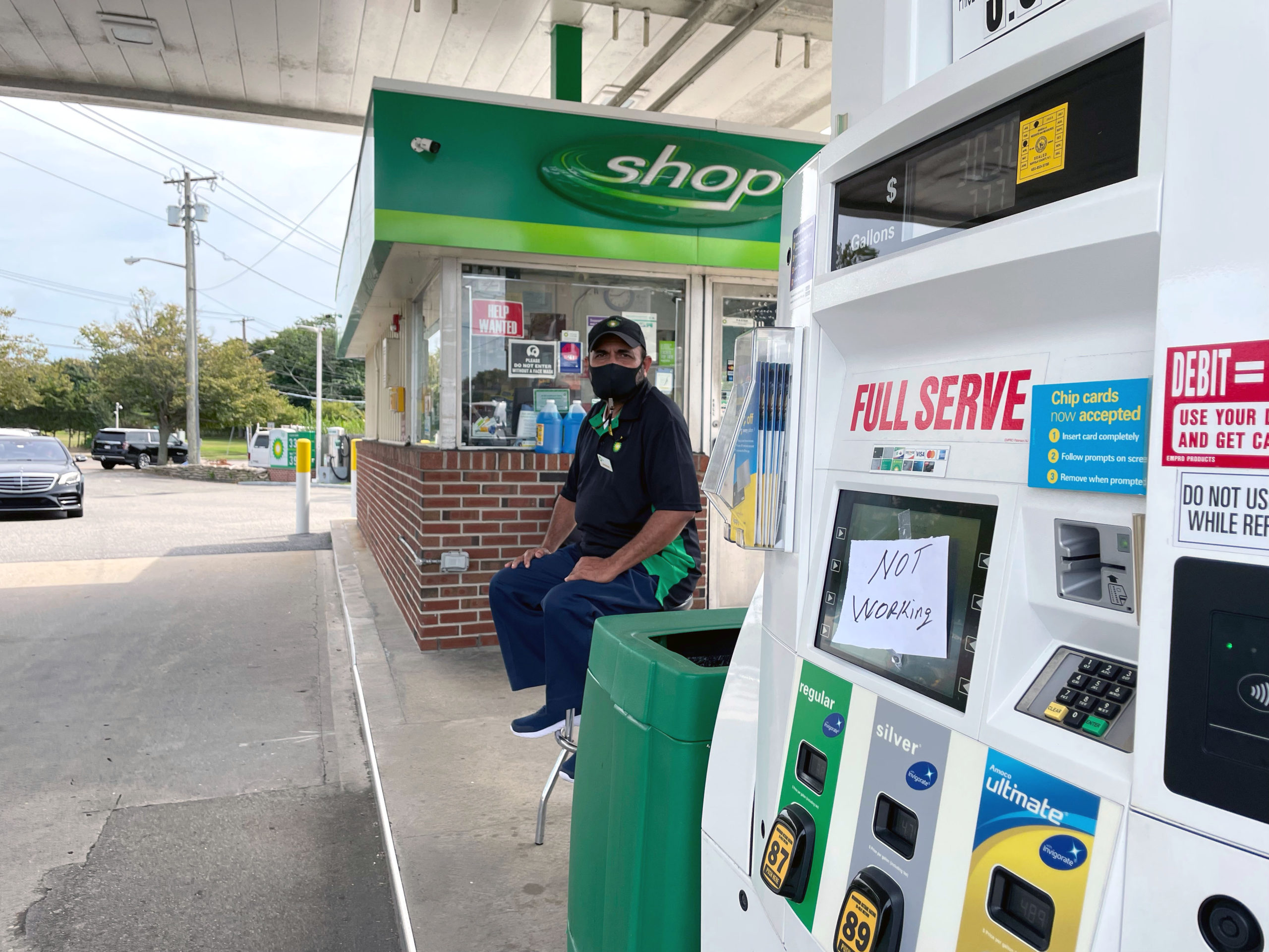 Naeem Siddiqui sits waiting for more gas to arrive at the BP in Southampton. His station ran out of gas Saturday.    ALEC GIUFURTA