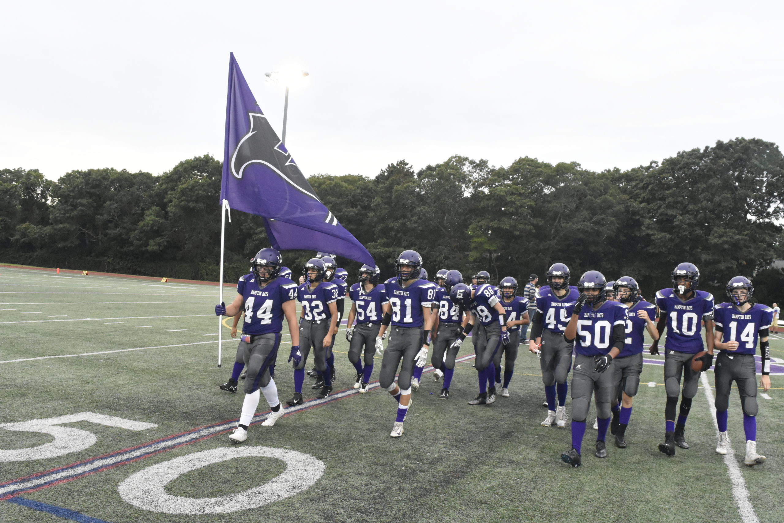 Cooper Shay led the Baymen out onto the field just before Friday's game against Greenport/Mattituck/Southold.