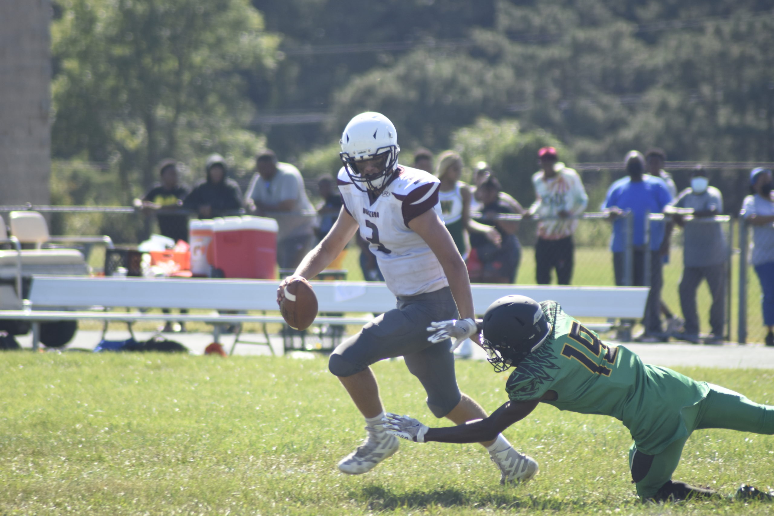 East Hampton sophomore quarterback Charlie Corwin avoids being sacked.