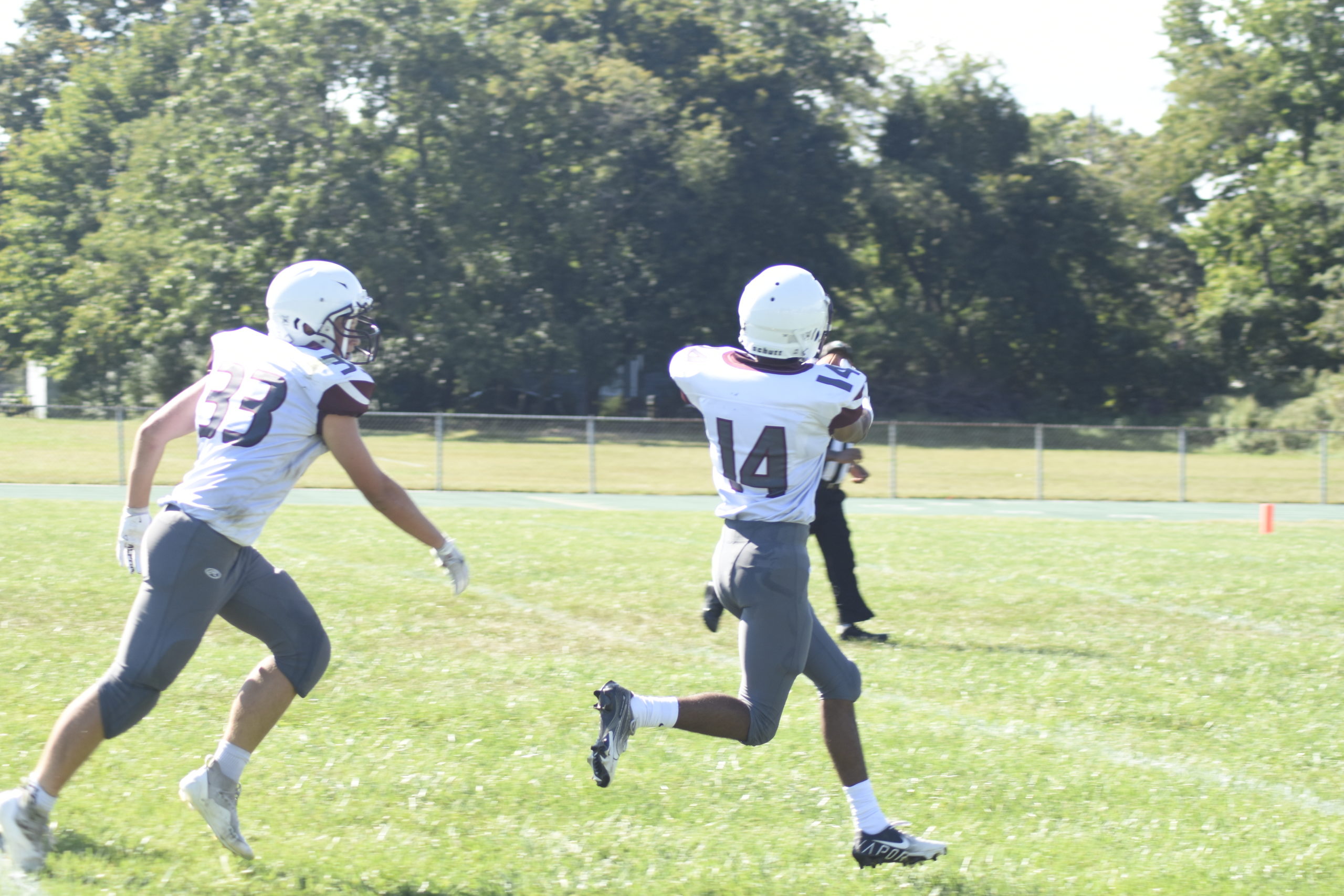 East Hampton's Aryan Chugh catches a deep pass and scampers into the end zone for a touchdown right before halftime.