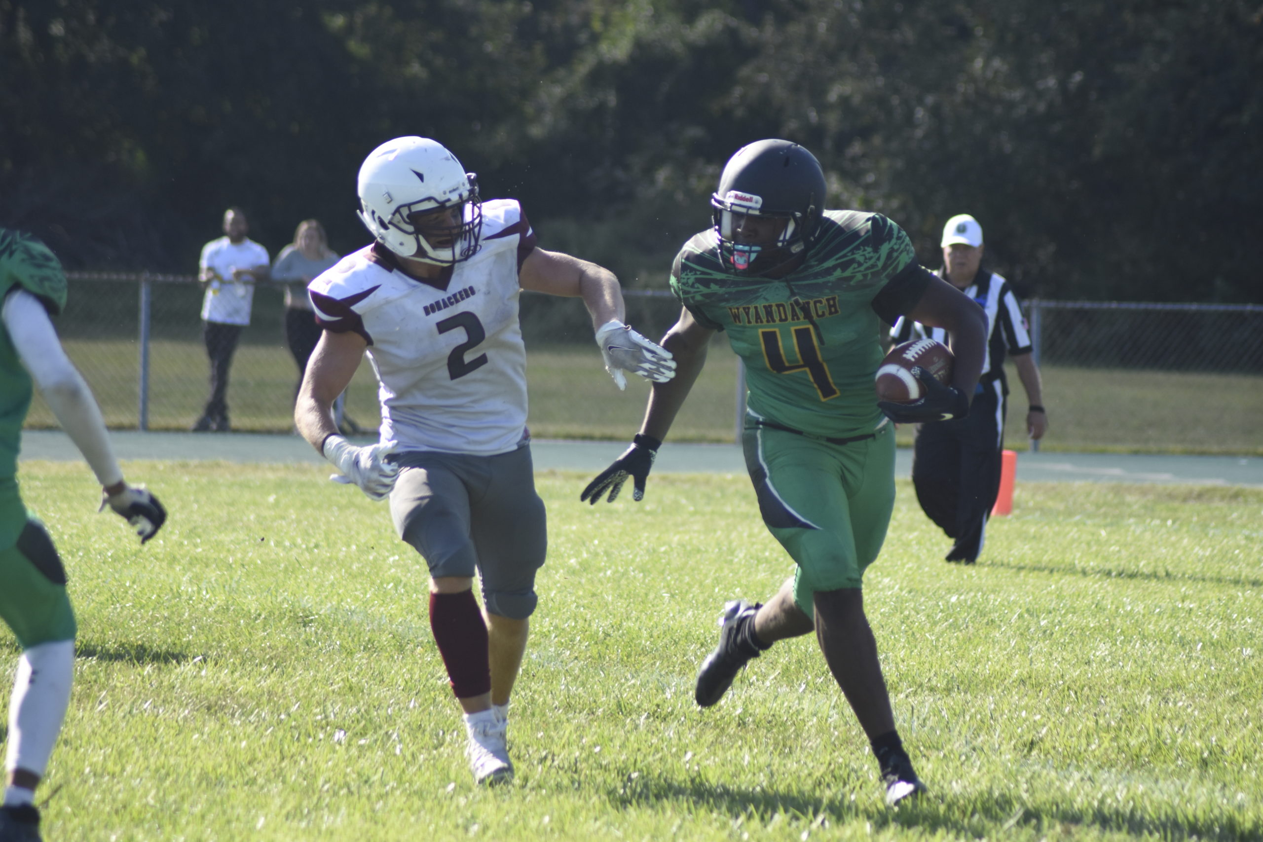 Bonac junior Finn Byrnes pressures Wyandanch's quarterback.