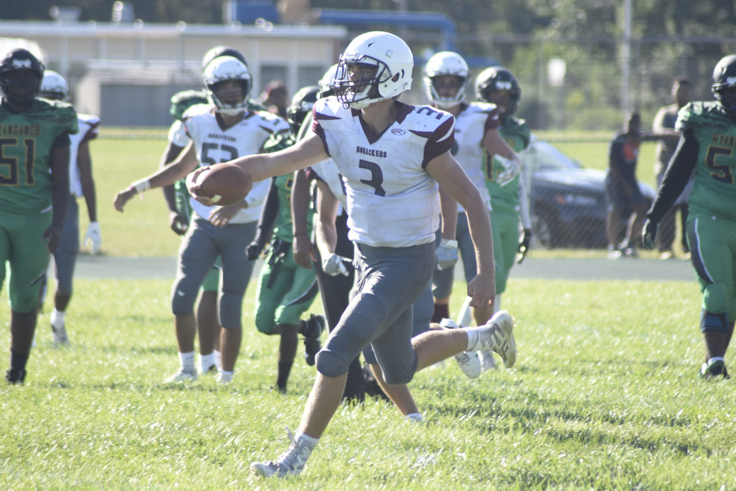 Sophomore quarterback Charlie Corwin scores to give East Hampton it's final tally, 35-12, at Wyandanch on Saturday.  DREW BUDD