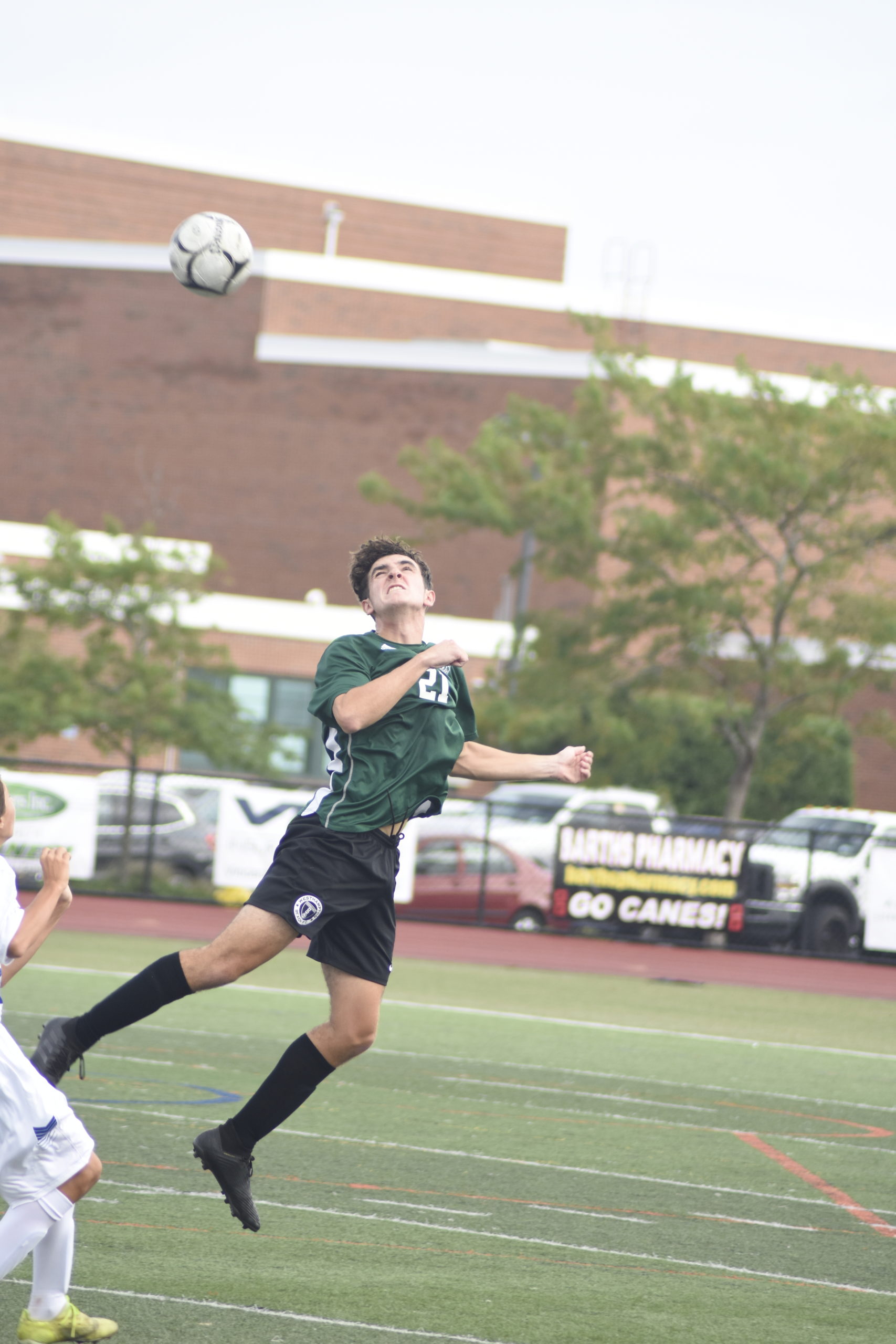 Westhampton Beach senior Liam McMunn heads the ball.