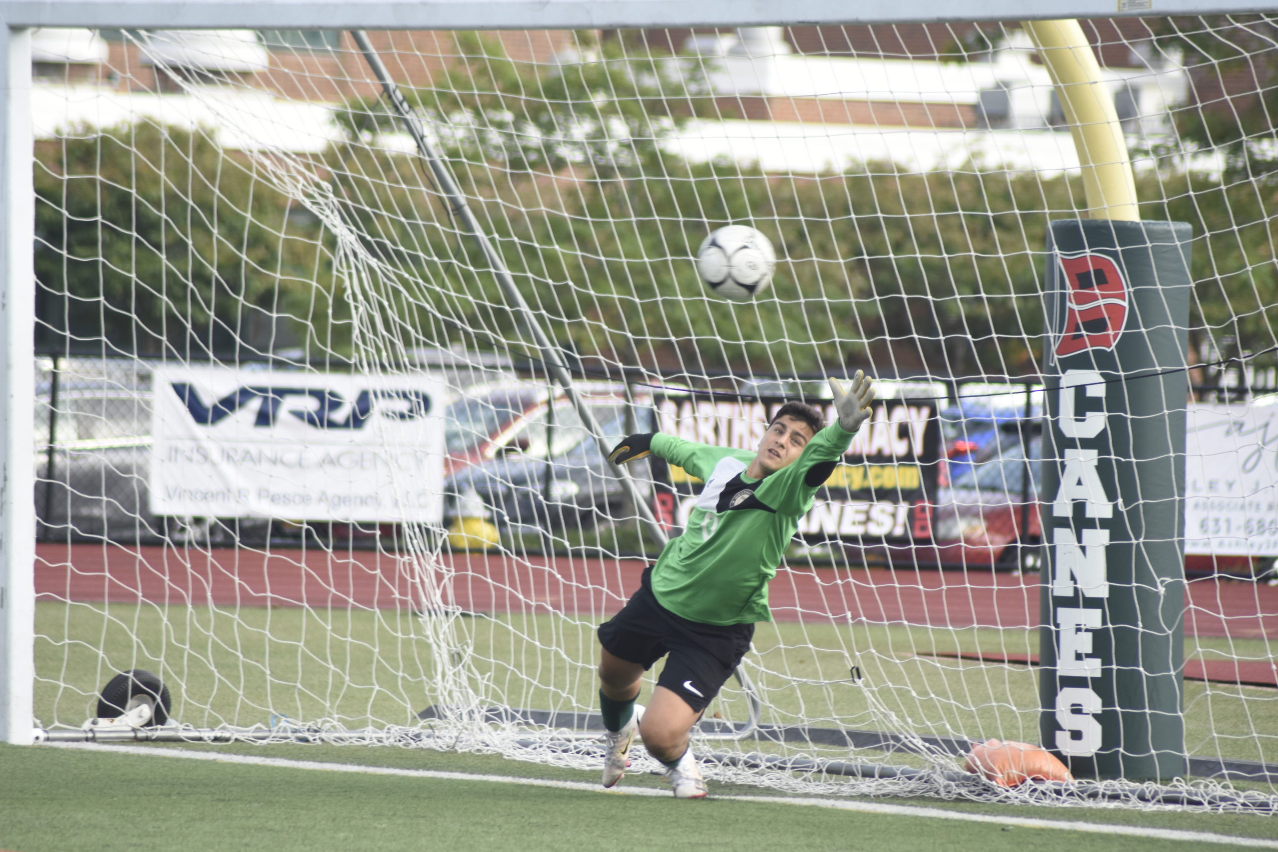Westhampton Beach senior goalie Alessandro Volpe goes all out to try and make a save on a penalty kick but to no avail.