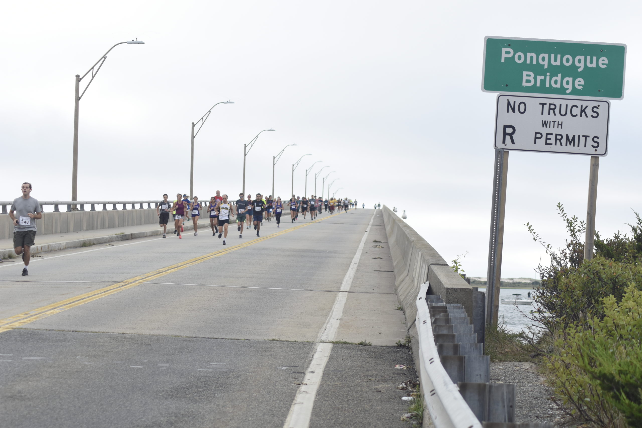 Runners make their descent over Ponquogue Bridge on Saturday morning for the Over The Bridge 10K and 5K races.