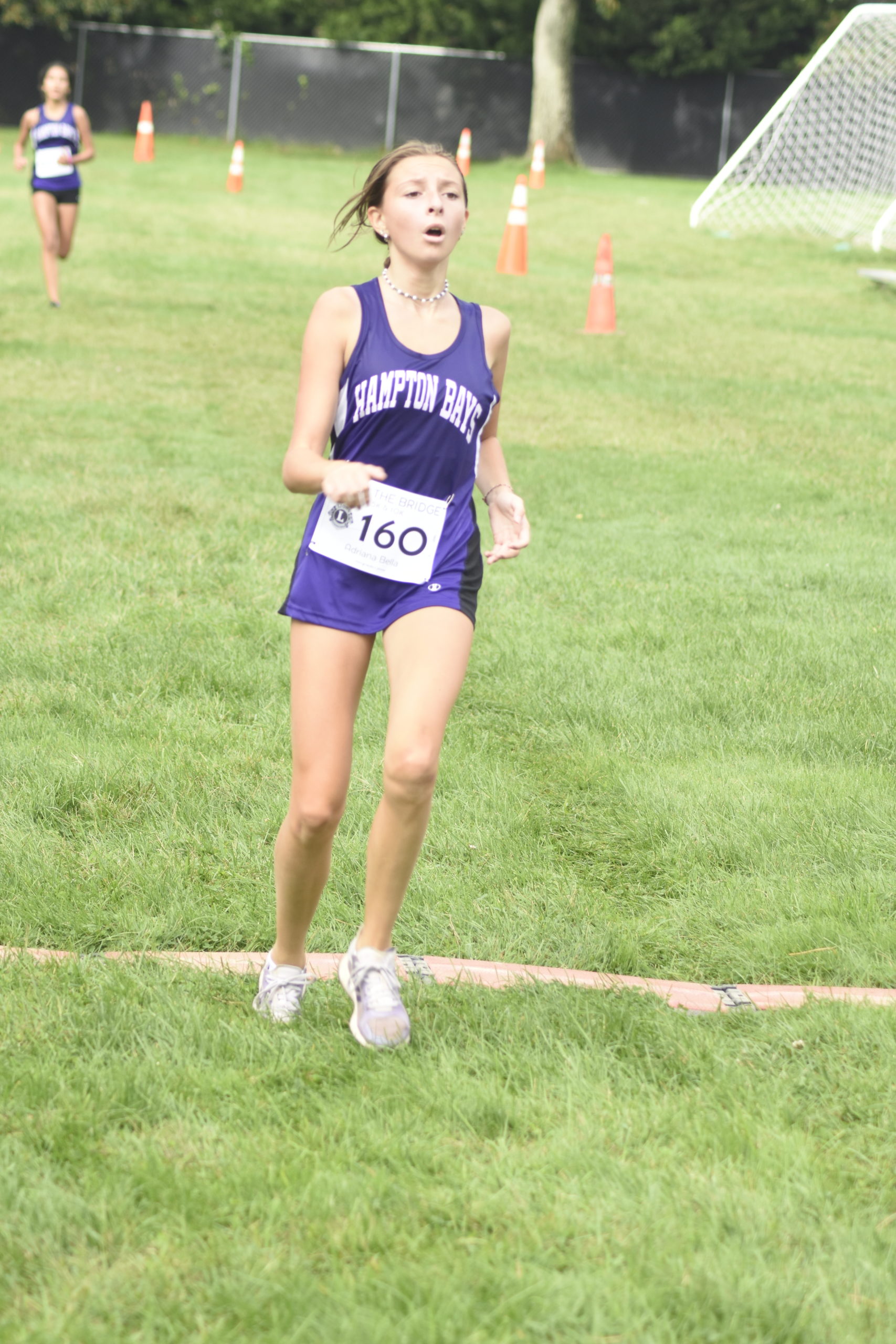 Adriana Bella Tapfer, 13, of Hampton Bays, and a member of the Baymen cross country team, finished second among women.