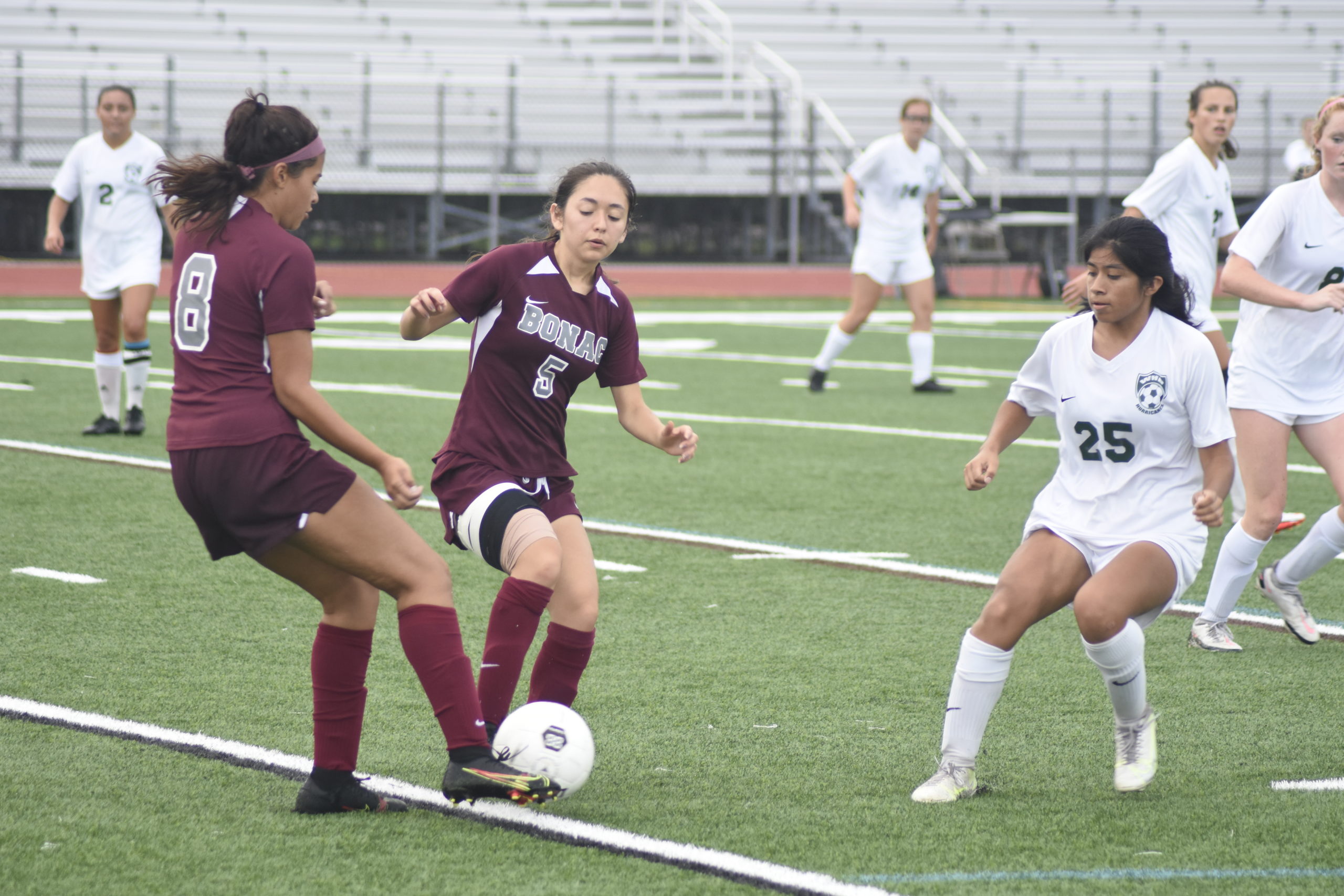 Bonackers Daniela Chavez (5) and Melanie Luque try to avoid one another as Hurricane Sintia Gregorio pressures them.