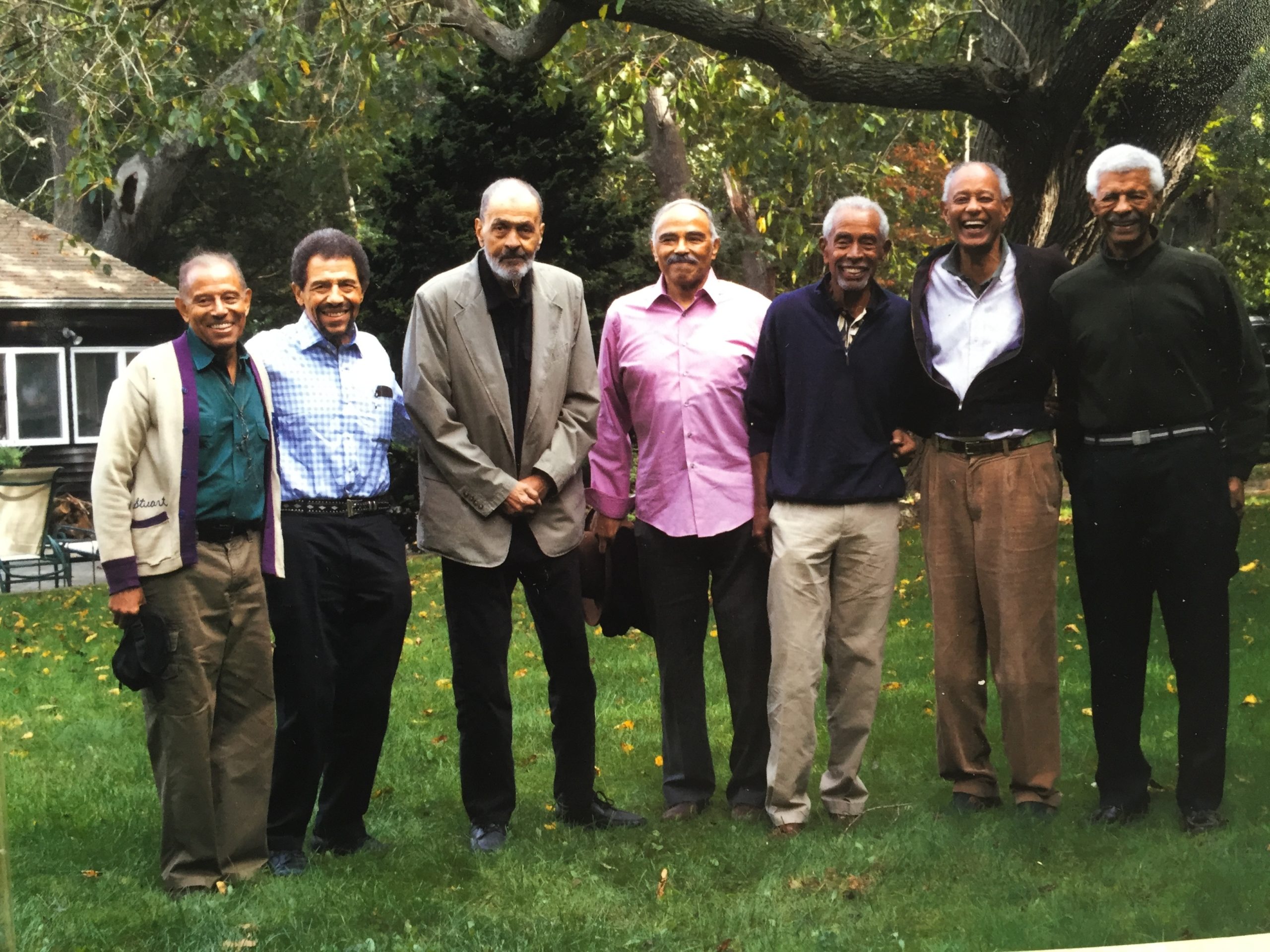 William Pickens III, far right, with his friends, from left: Dr. Stuart R. Taylor, Dr. Phillip Taylor, Tony Johnson, Thomas Watkins, Benjamin Finley, and E.T. Williams, Jr. Behind them is a tree where Langston Hughes once sat to write poetry during a visit to Sag Harbor. The friends grew up together in the Bedford-Stuyvestant section of Brooklyn and spent summer together in Sag Harbor. They were all members of the Centurion Club, a social club based in New York City.
