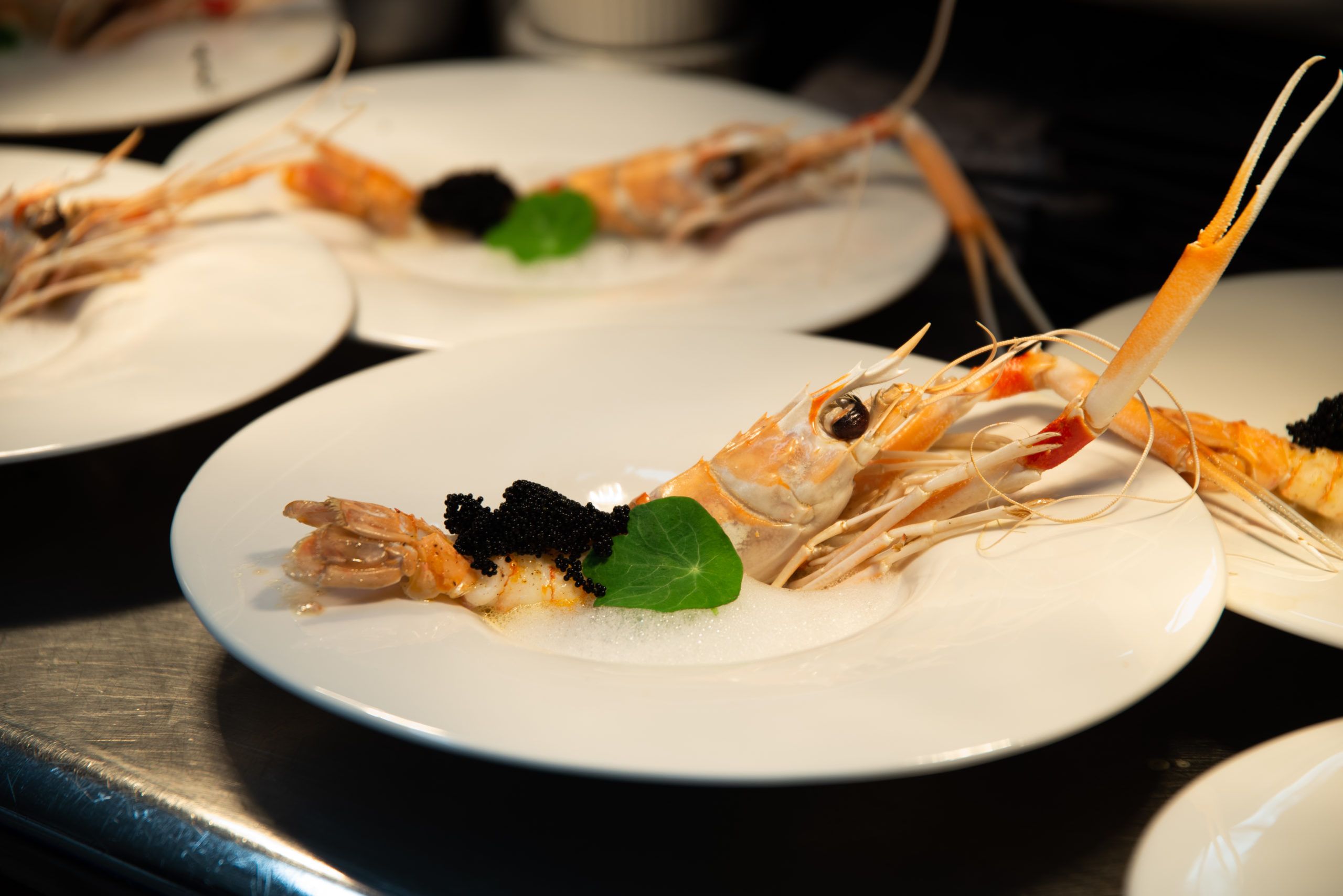 Cigalas, a dish featuring Norwegian prawns, fermented black beans and lemon air, as part of the R.AIRE dining experience at The Hampton Maid in Hampton Bays.