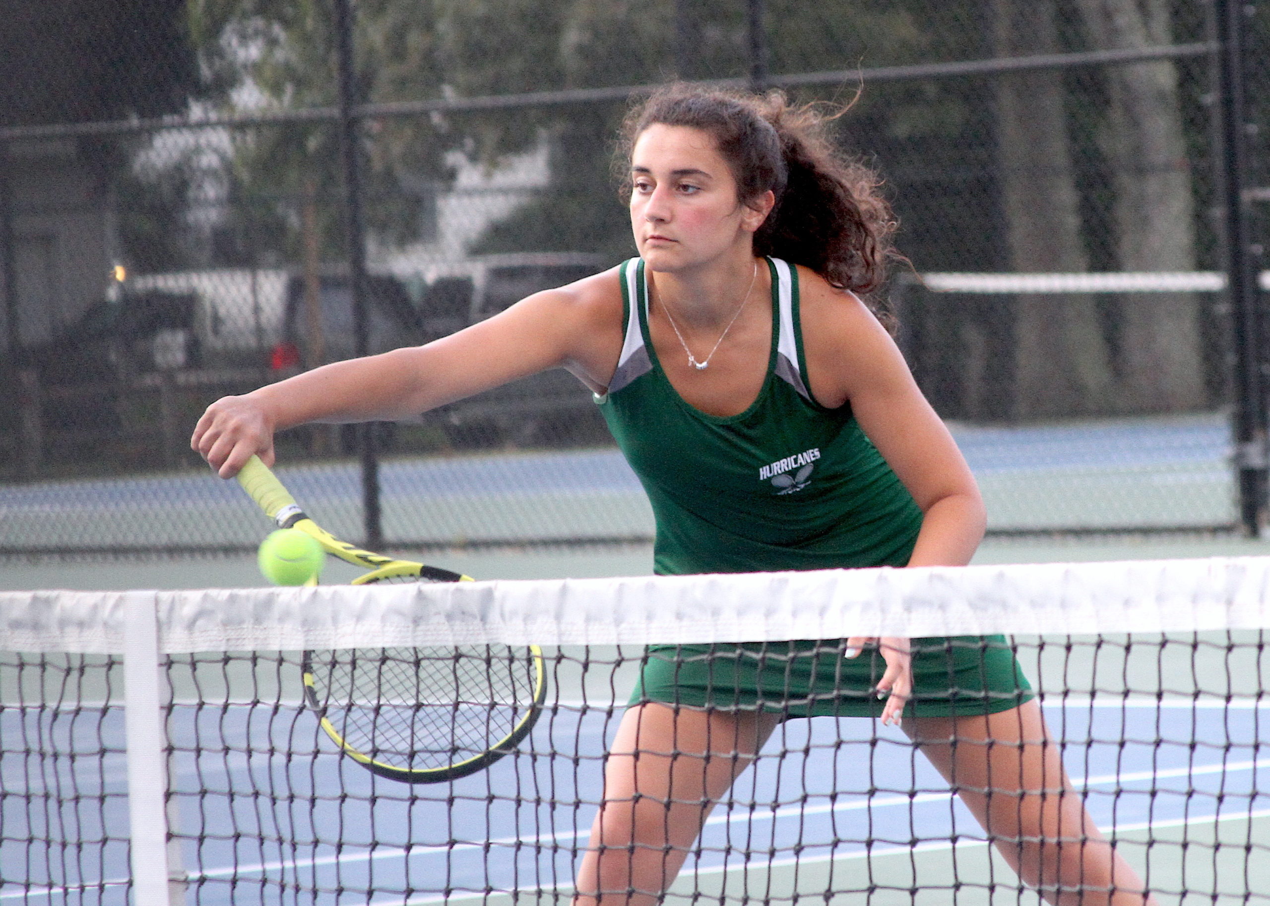 Westhampton Beach senior Emily D'Alessandro catches a ball at the net for her No. 1 doubles team. DESIRÉE KEEGAN