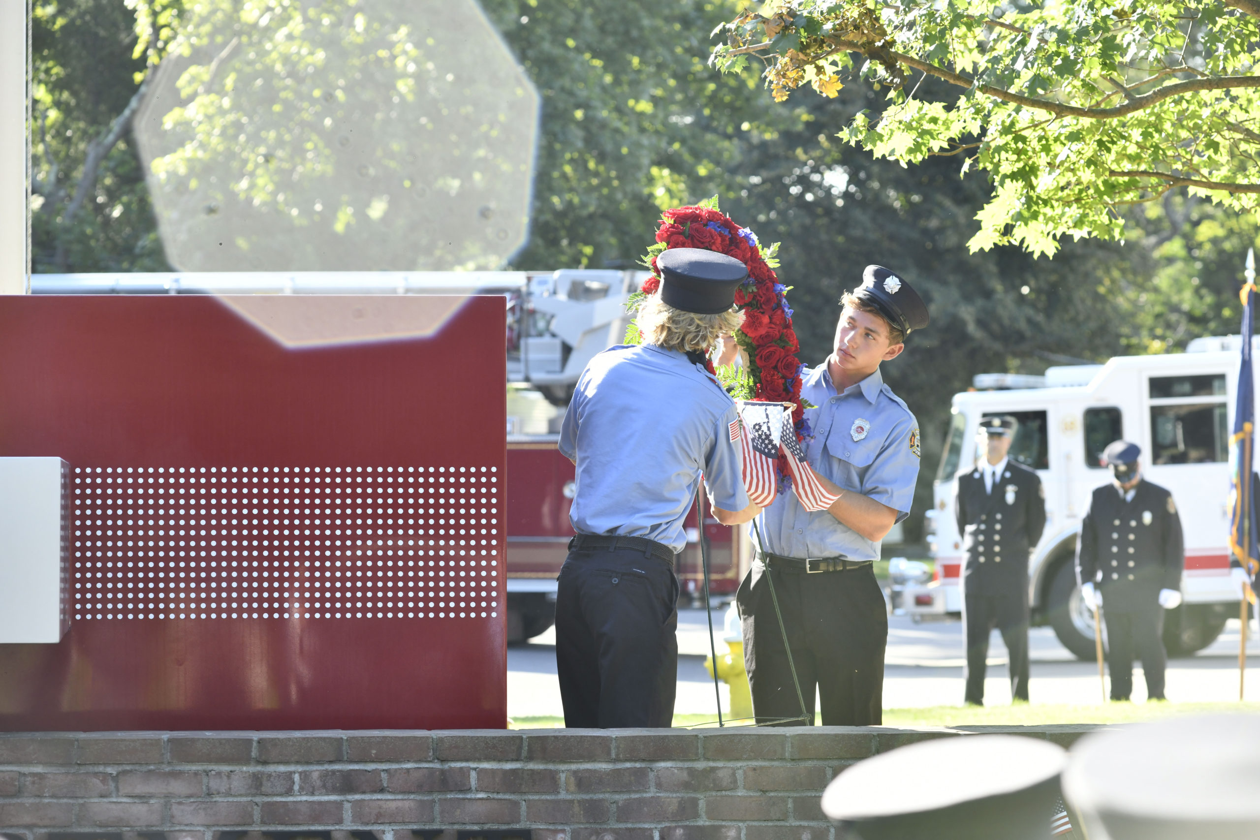 Members of the Southampton Fire Department Juniors lay the wreath at the memorial.