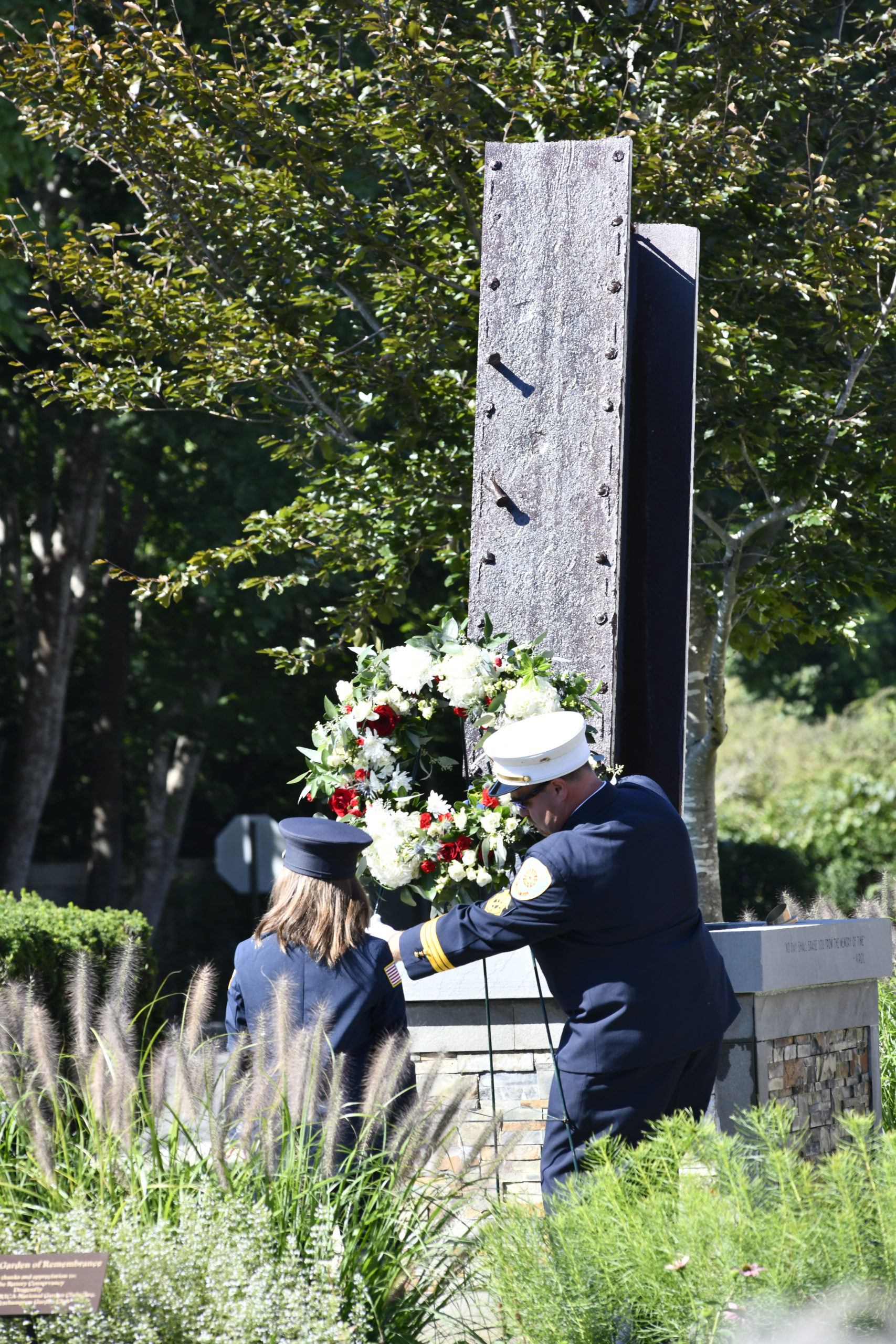 The wreath is laid at the rededication of the Quogue 9/11 Memorial on Saturday.