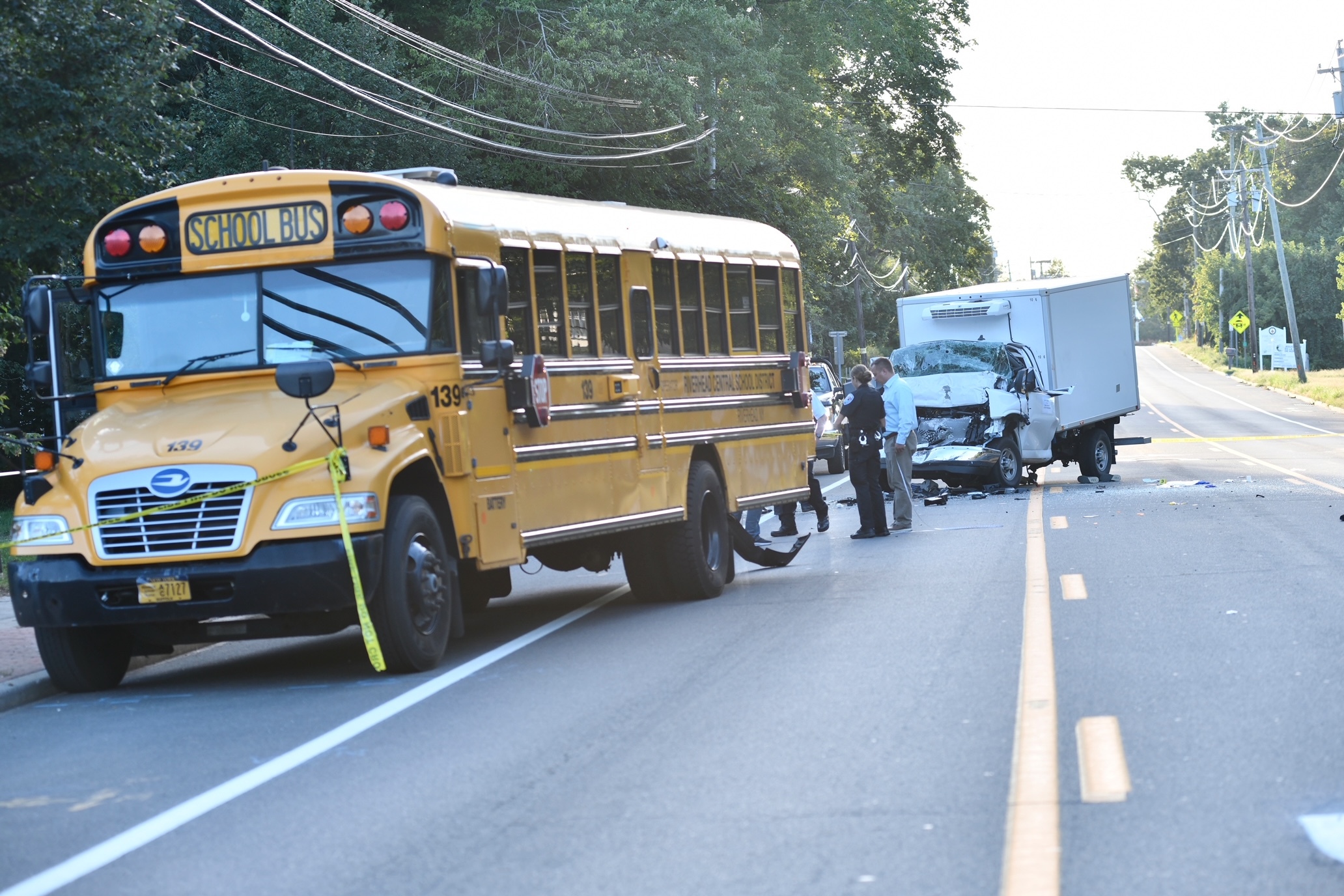 A box truck rear-ended a school bus on Flanders Road on Monday afternoon.