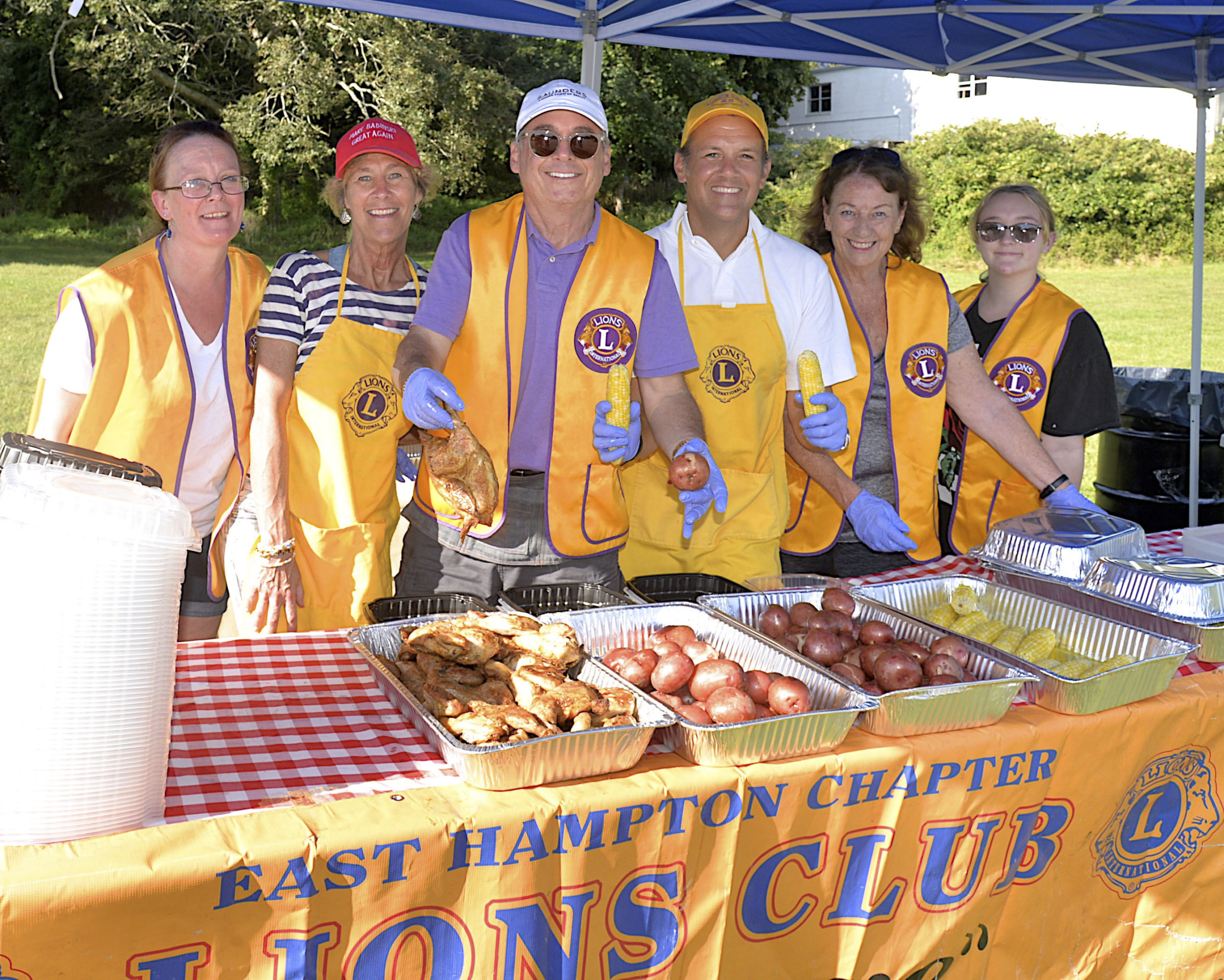 East Hampton Lions Club members,  Bridget Lynch, Tina Piette, Darius Narizzano, Carl Irace, Eve Gerard and Jaden Lynch at the Lions Club chicken barbeque on Saturday afternoon.  KYRIL BROMLEY