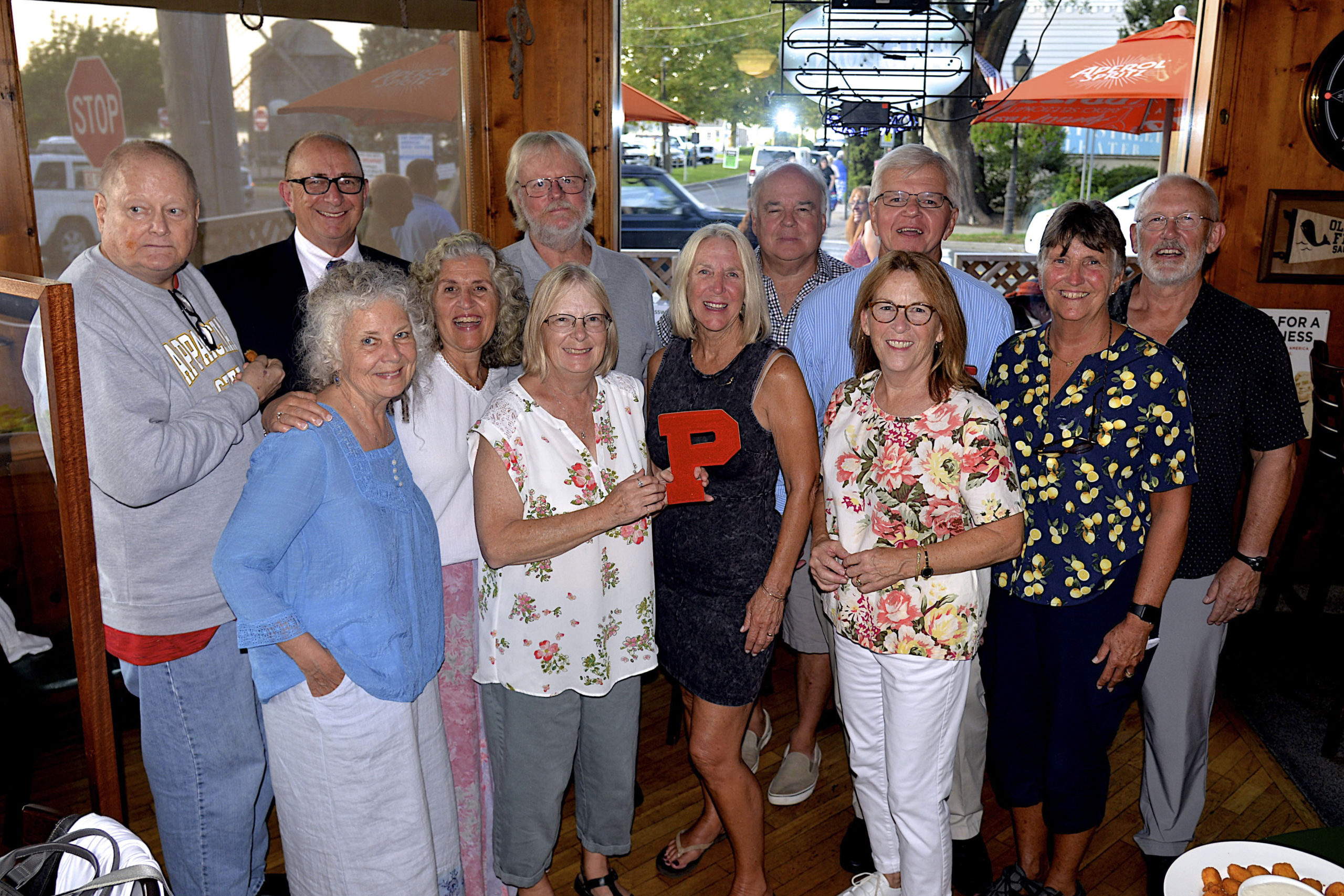 Some of the members of the Pierson Class of 1971, Michael Remkus, Steve Haerter, Marion Allen, Cathy Santacroce-Worwetz, Harold Worwetz, Colleen Stafford, Beth O’Sullivan, Tim Mott, Fred Thiele, Vee Bennett, Bethany Deyermond and Mark Weiderst, met at the Corner Bar in Sag harbor on Saturday evening to celebrate their 50th reunion.    KYRIL BROMLEY