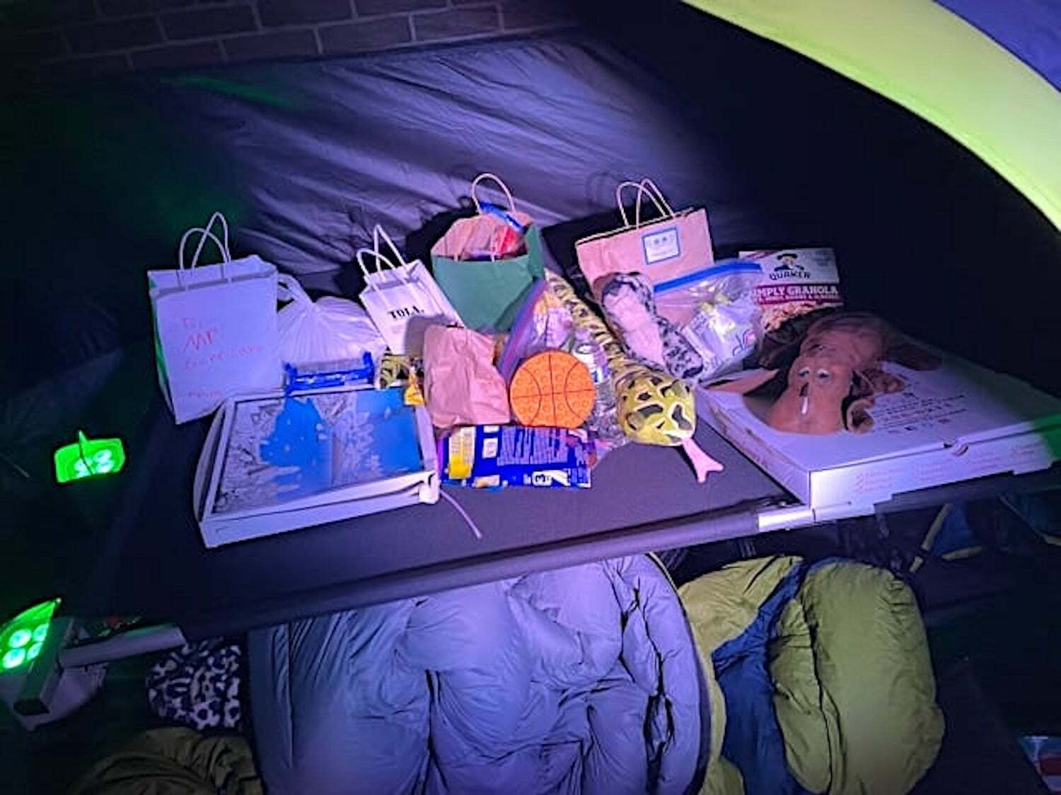 Westhampton Beach Elementary School Principal Jeremy Garritano received gifts and snacks from families while sleeping in a tent on the roof of the school Monday, September 27. JEREMY GARRITANO