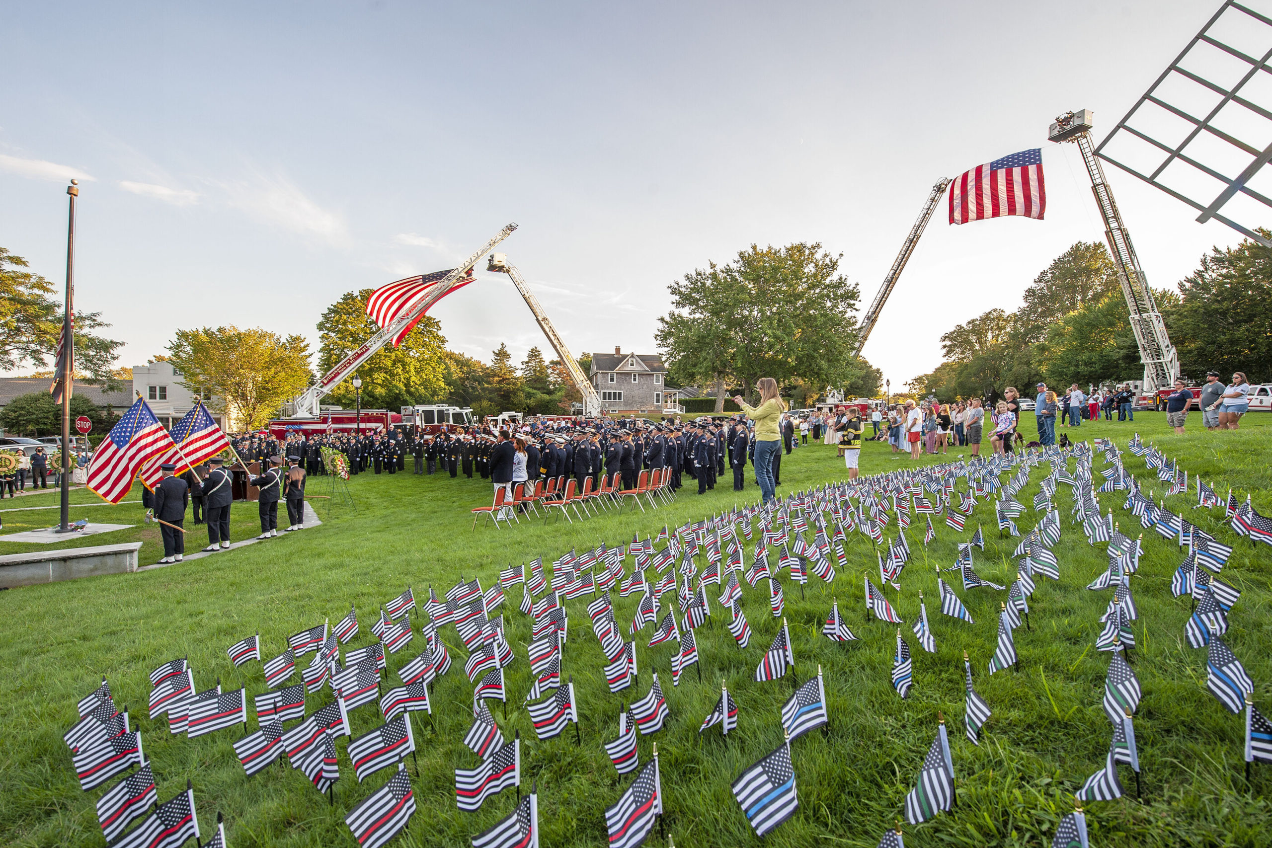 Individual flags for every member of the fire, police or military who died at 9/11 were  laid out during a ceremony commemorating the 20th anniversary of the attack on the World Trade Center, held on the Village Green in East Hampton and attended by 11 different East End fire, police and EMS agencies on Saturday afternoon.