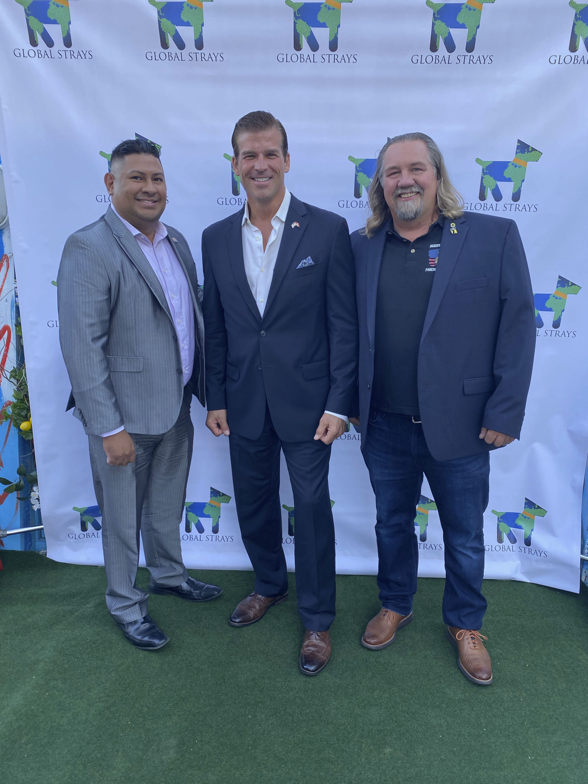 retired marines Leith Lewin, Jack Hartnett and Orley Pacheco at Global Strays cocktail party.    GREG D'ELIA