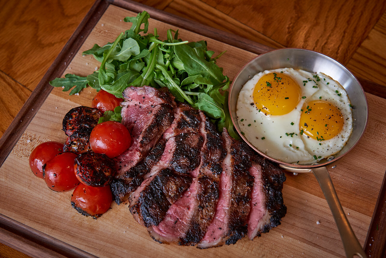 Main Street Tavern's grilled hanger steak with crispy fingerling potatoes and sunny side up eggs.