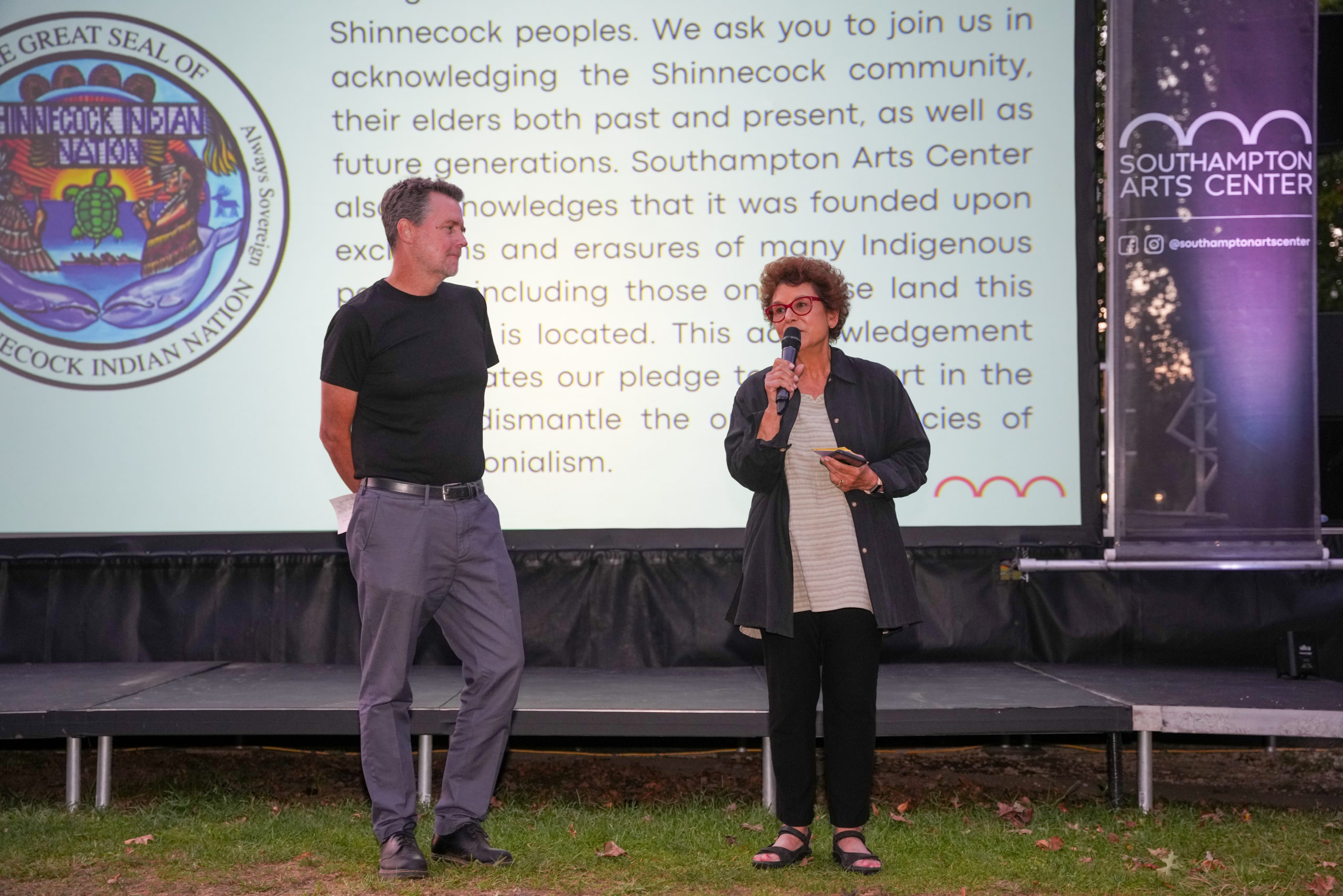 Tom Dunn, executive director of the Southampton Arts Center, left, and Jacqui Lofaro, executive director of Hamptons Doc Fest, open Friday night's festivities.