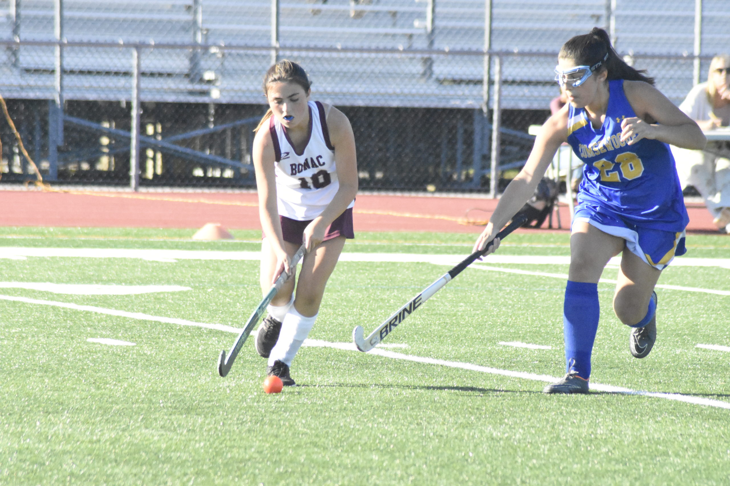 East Hampton junior Sadie Cober works the ball at midfield.