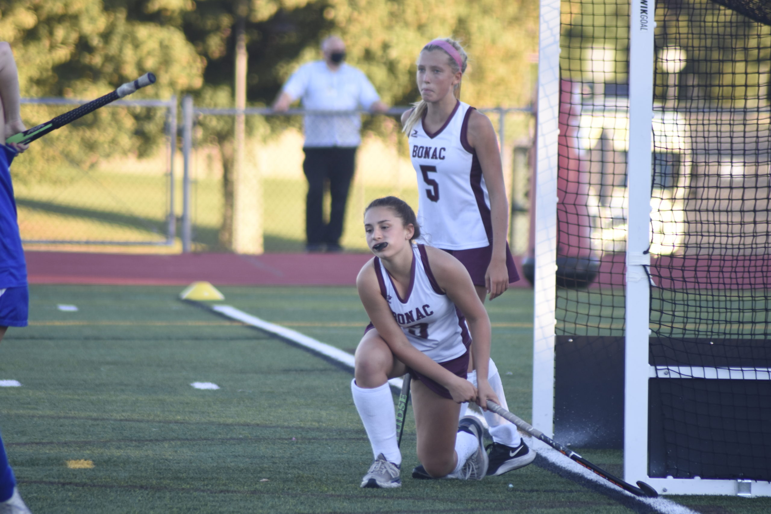 East Hampton juniors Chloe Coleman (5) and Casey Stumpf after the game-winning goal reached the back of the cage in overtime.