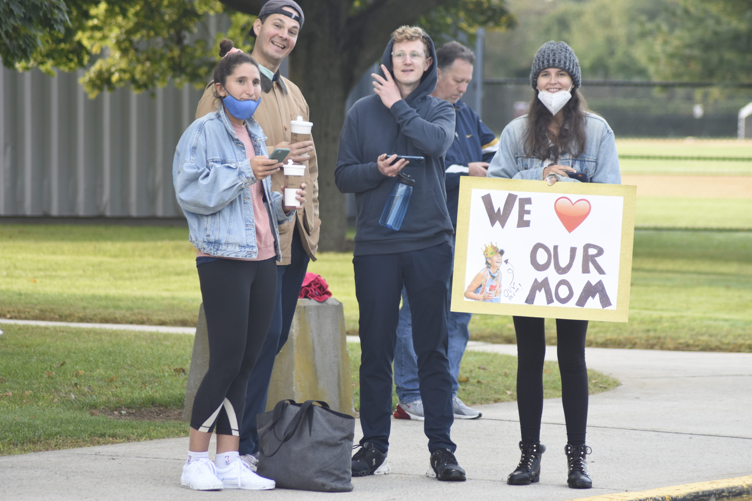 Onlookers cheer on family members at the Hamptons Marathon on Saturday morning.