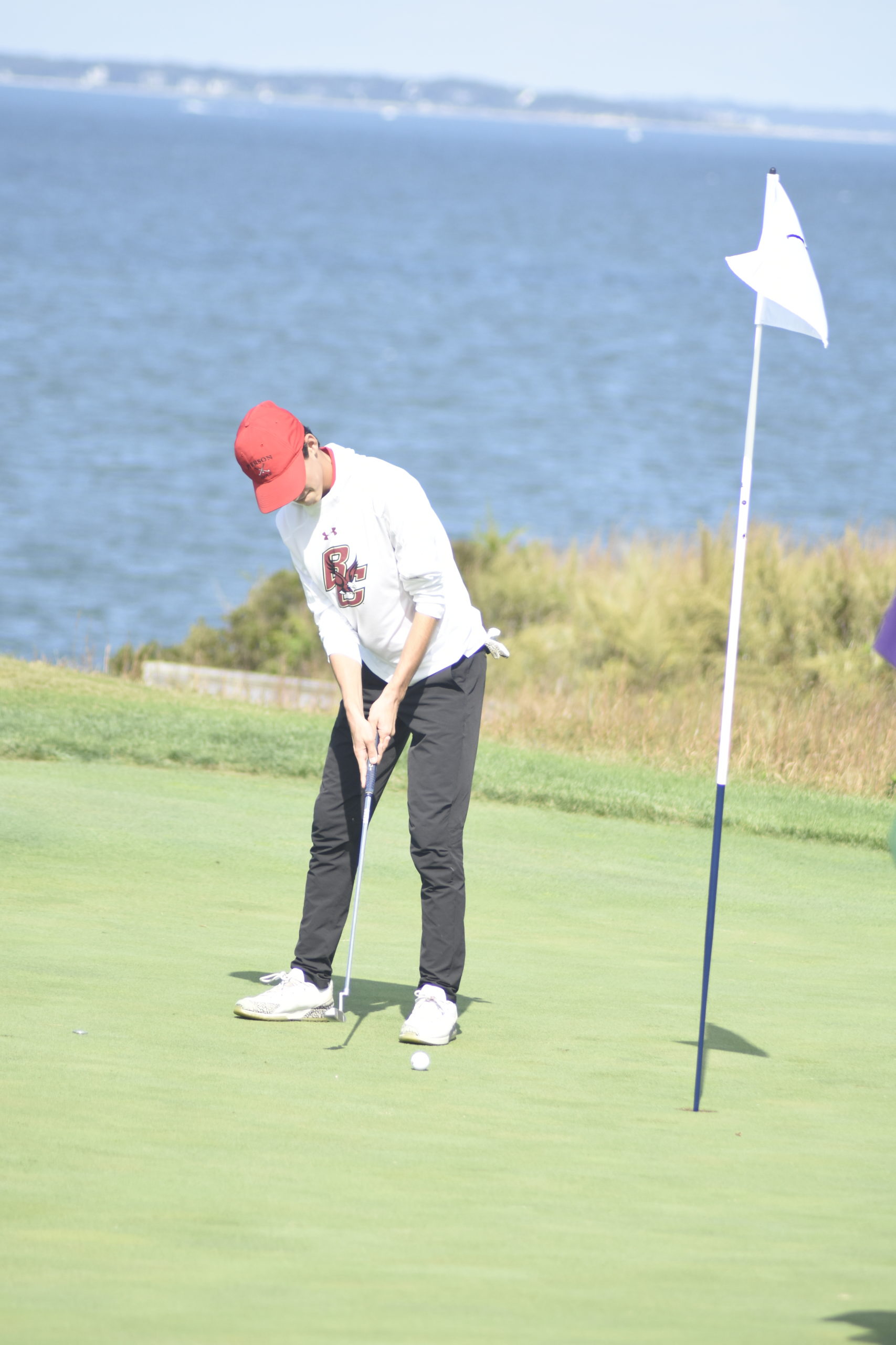 Pierson's Brenden Burke putts on the first hole at Sebonack on Friday.