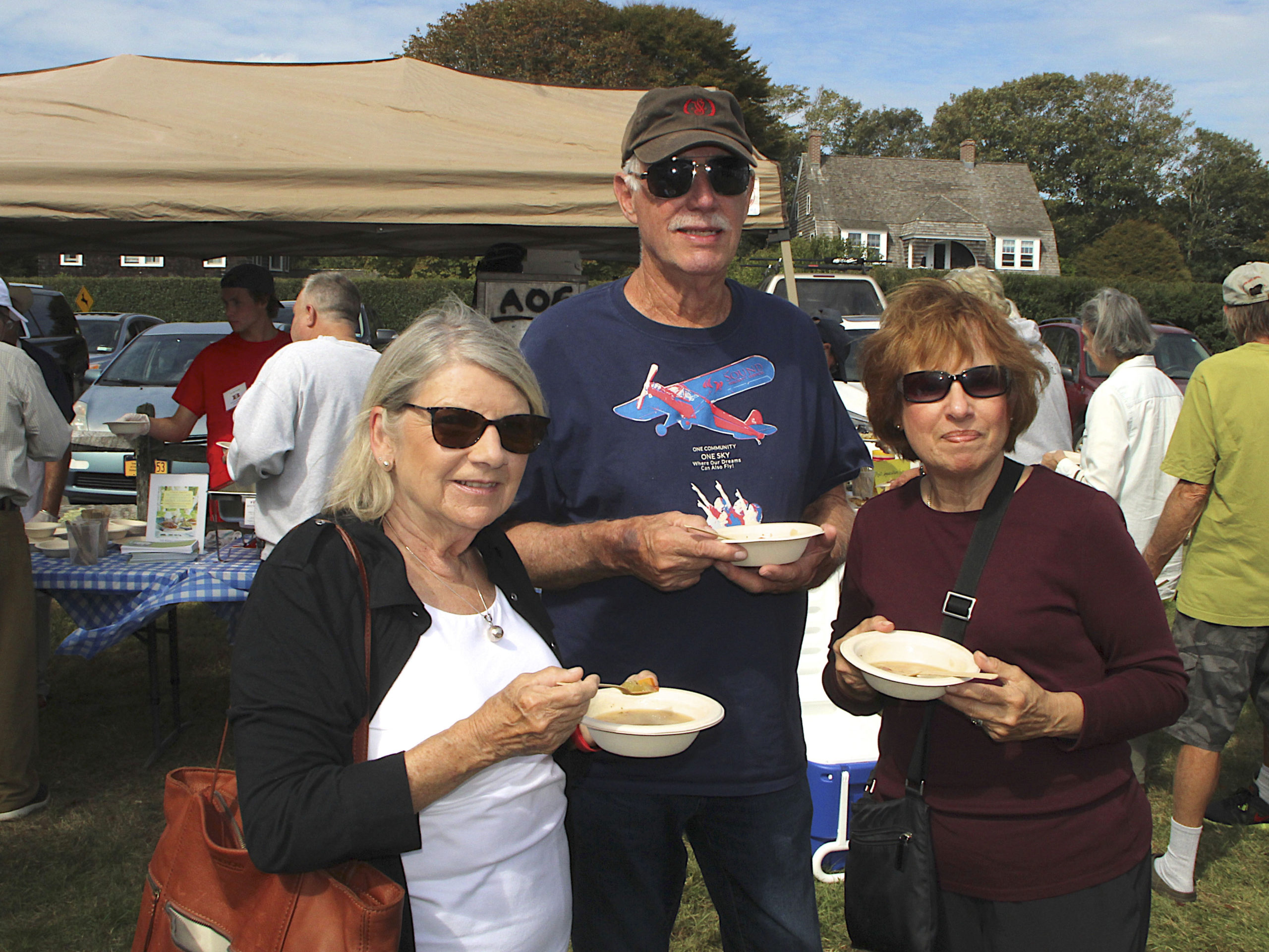 Nancy Mowry, Henry Birdsall and Carol McCarthy sample the chowder.