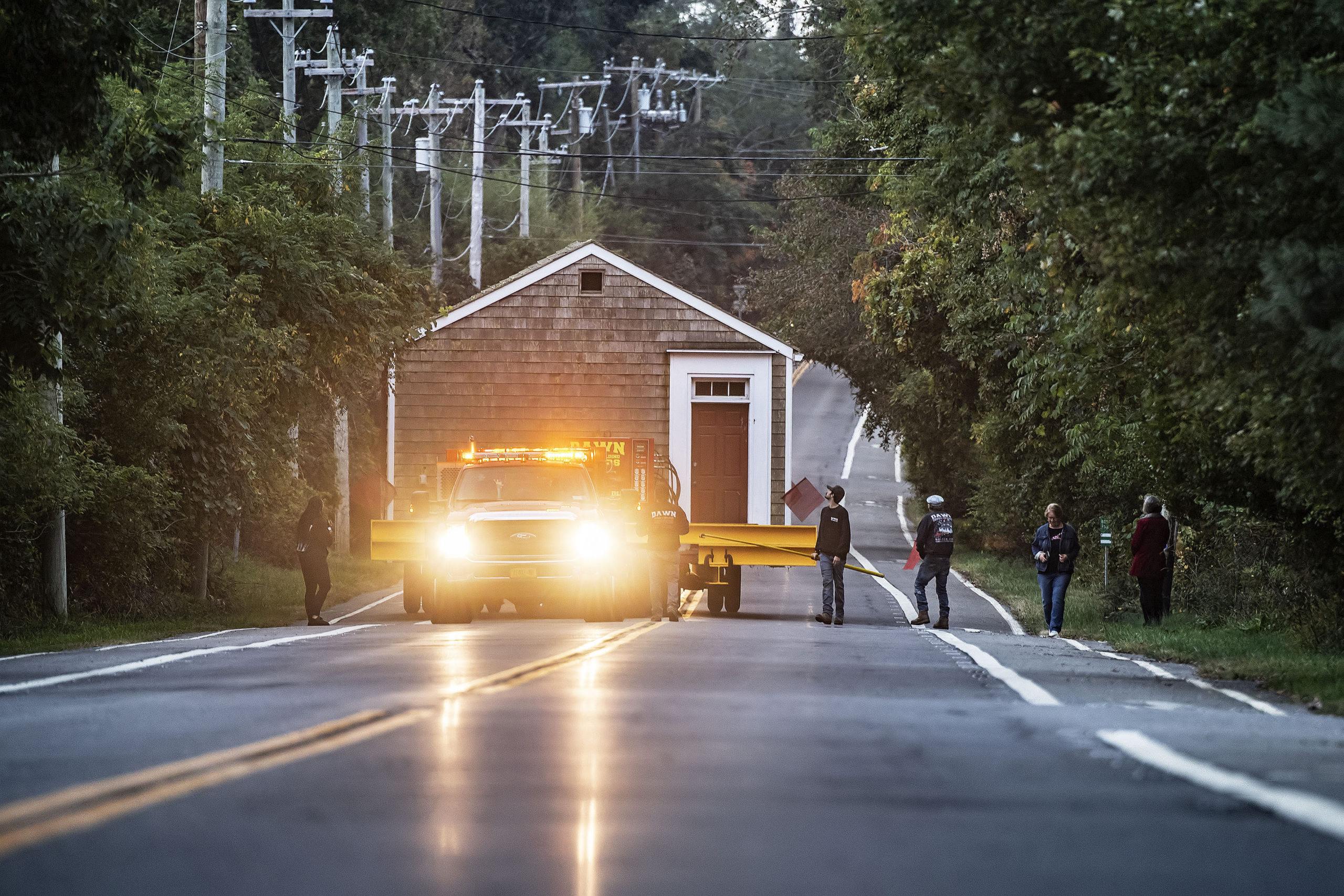 The old North Haven Schoolhouse was moved by Dawn House Movers from its location at the corner of Payne Avenue and Ferry Road to its new home adjacent to North Haven Village Hall on Tuesday.  MICHAEL HELLER